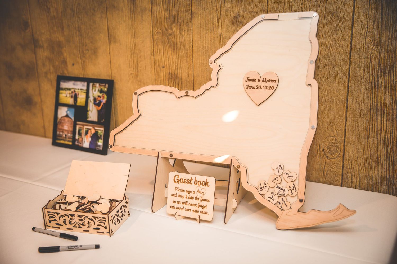 Wooden puzzle pieces arranged as wedding guest book alternatives on rustic table.