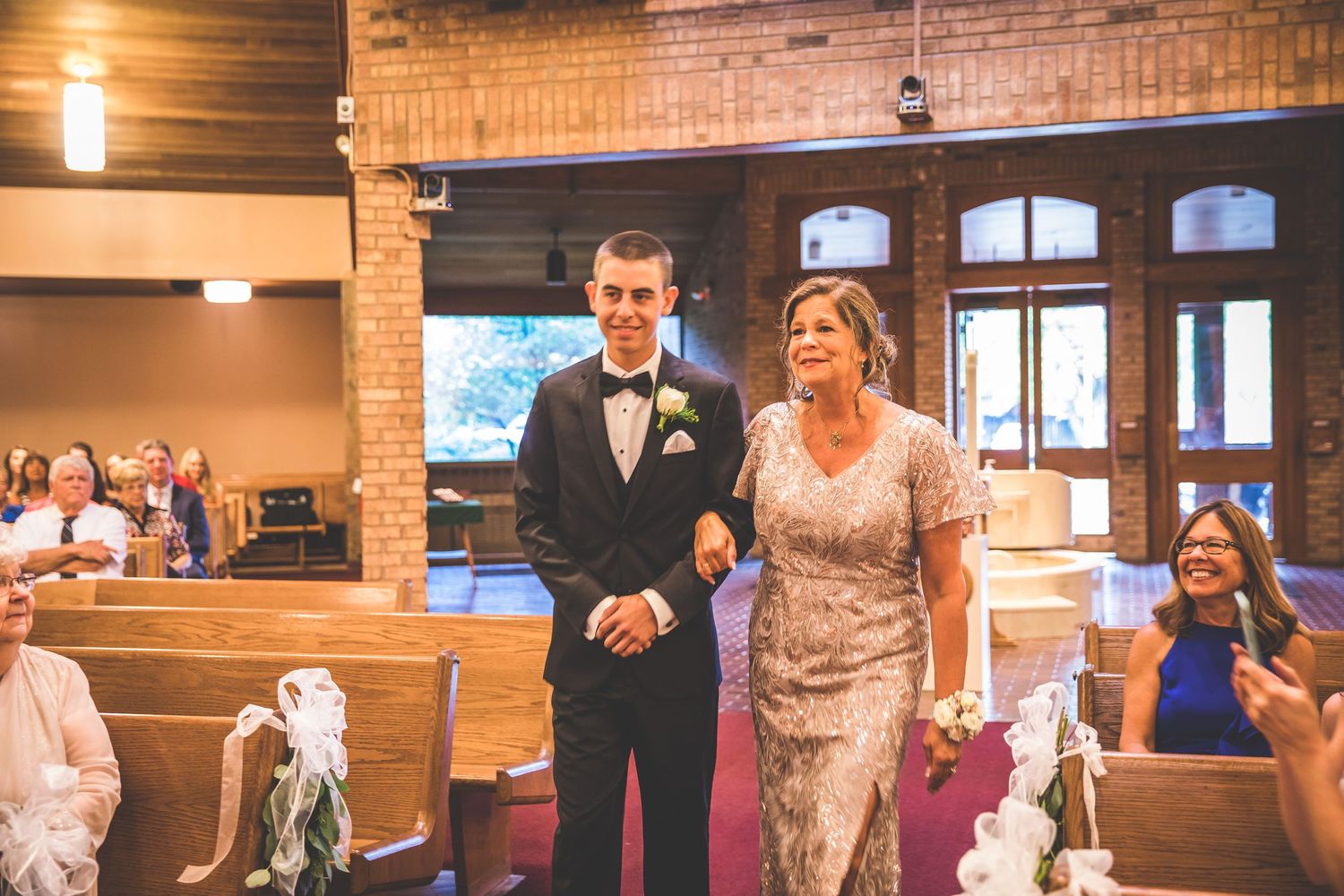 Wedding ceremony venue with exposed brick walls and wooden accents.