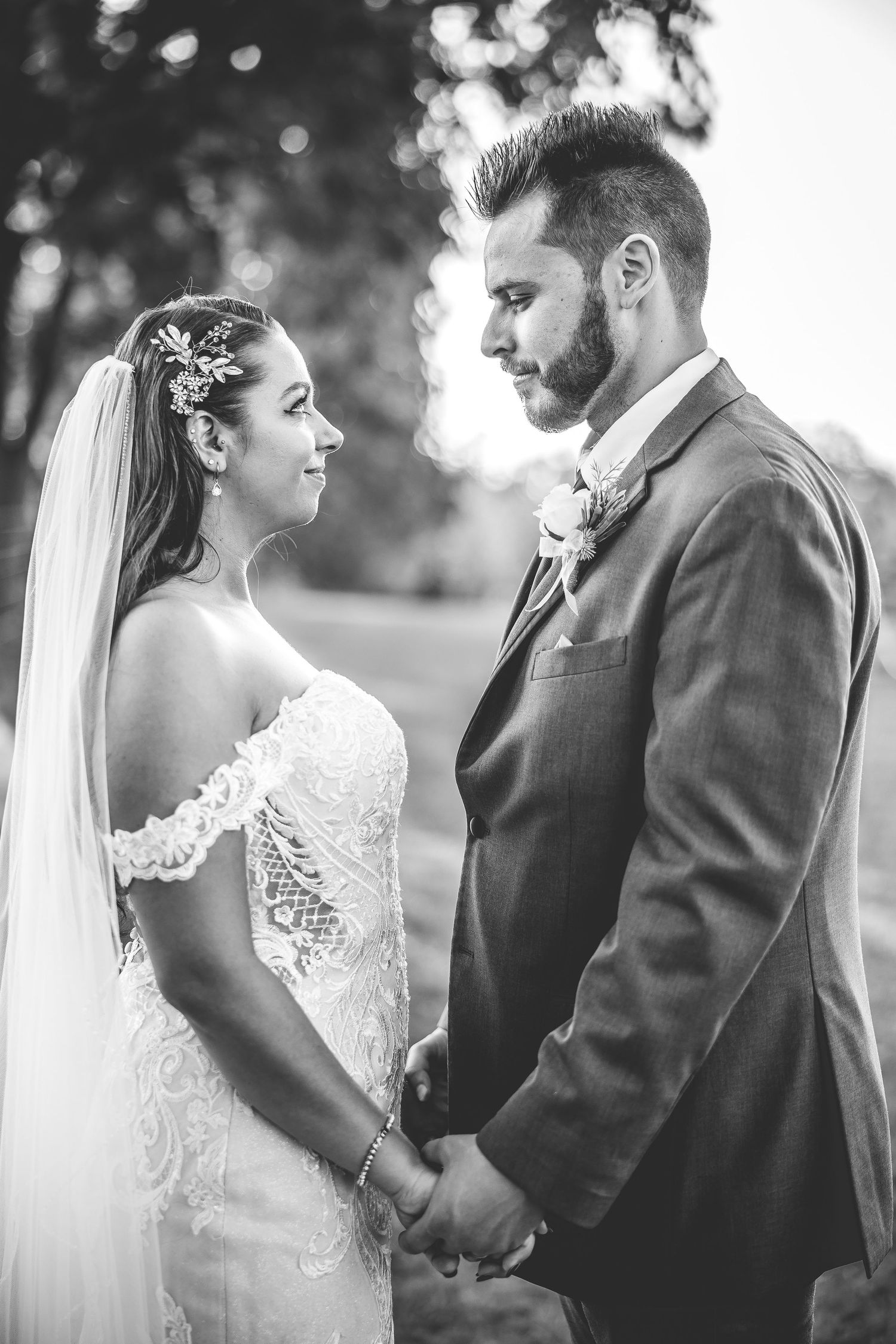 Black and white intimate wedding portraits showing tender moments between newlyweds.