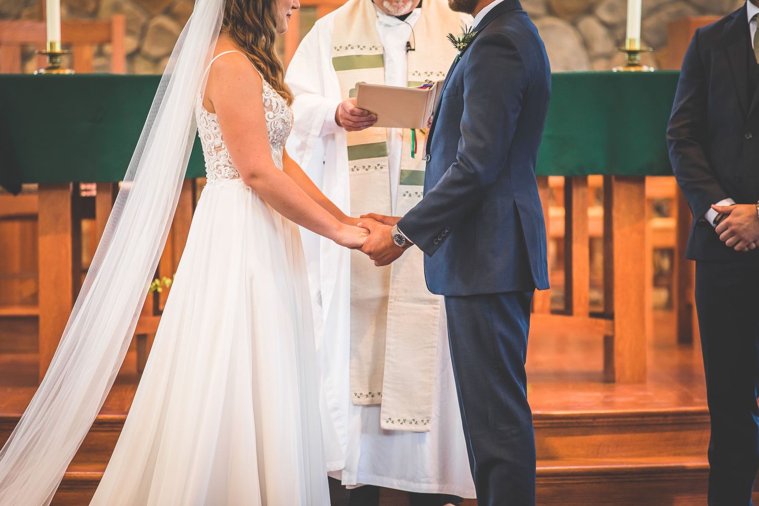 A sequence of wedding ceremony moments captured at the altar with stone wall backdrop.