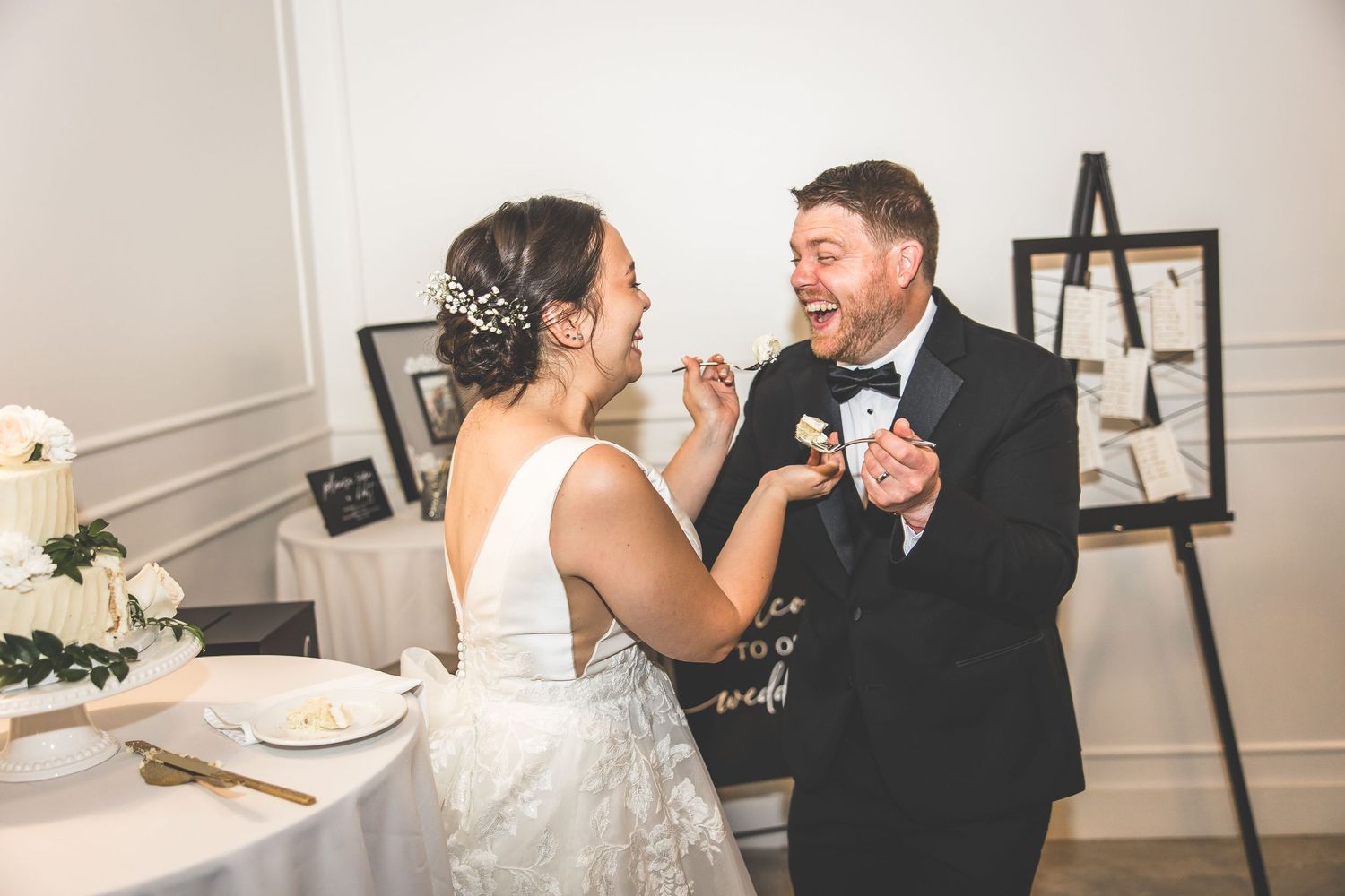 Intimate wedding reception moments captured between couple at decorated venue.