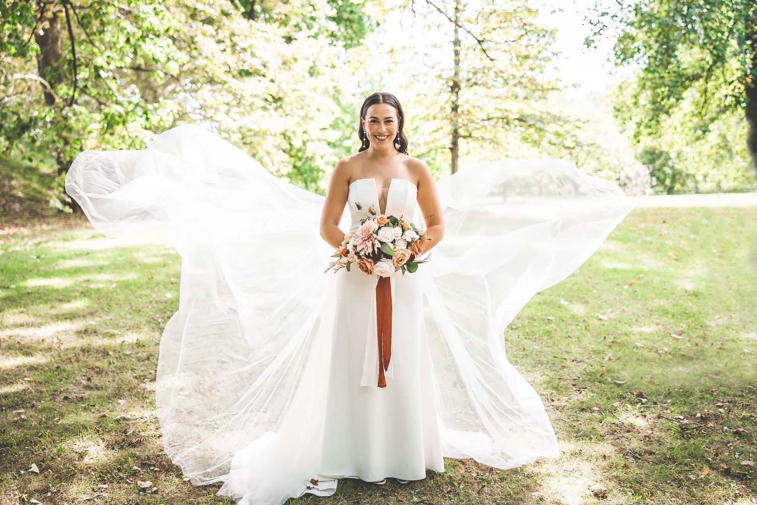 Elegant bridal portraits captured in a serene woodland setting with natural lighting.