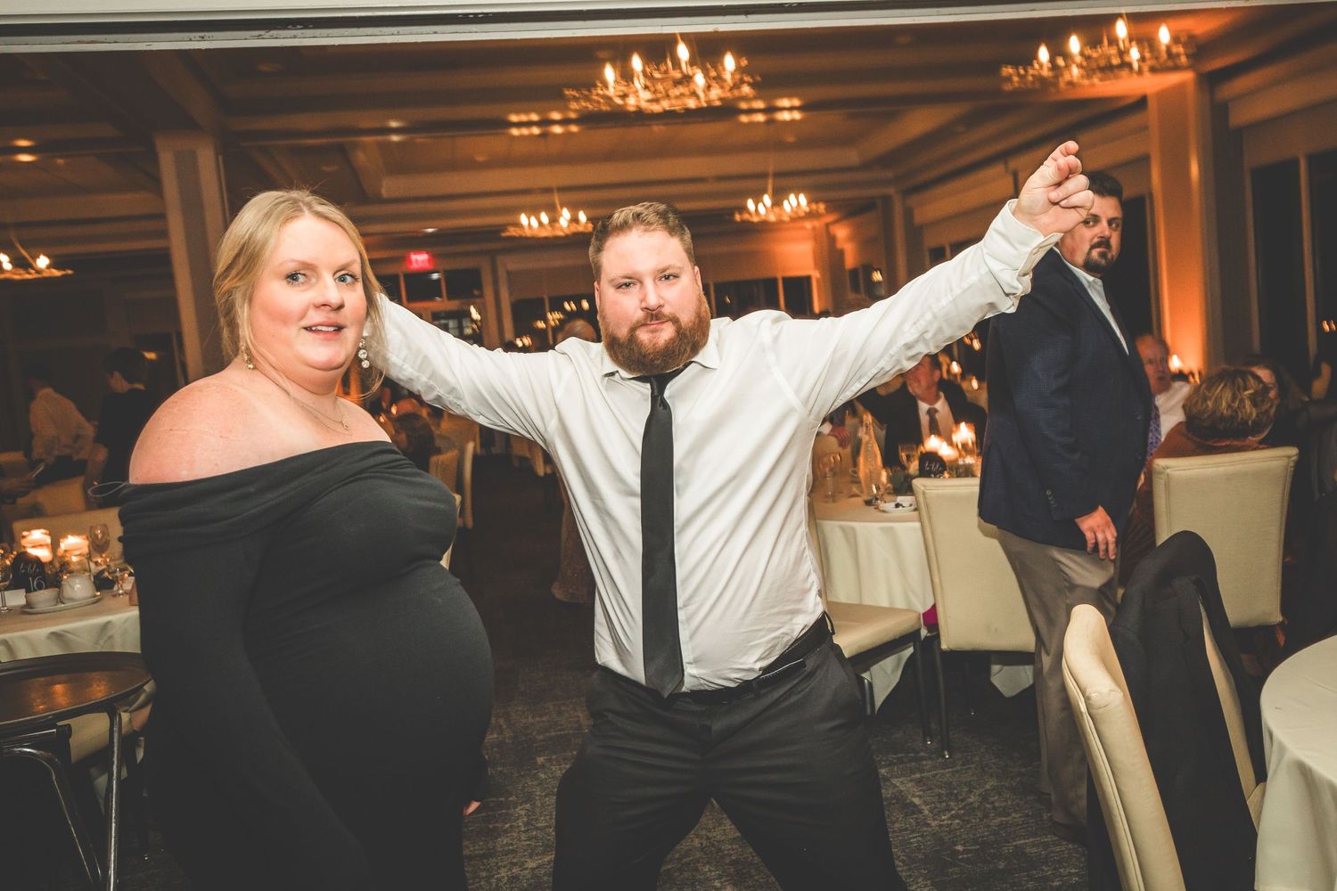 Couples dancing together during romantic moments at an elegant wedding reception.