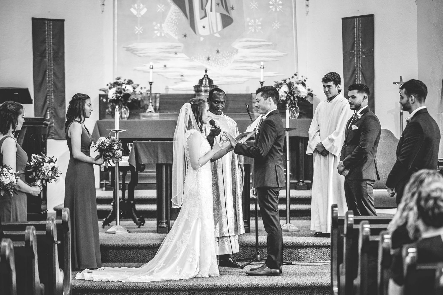 A sequence of black and white wedding ceremony photos showing moments at a church altar.