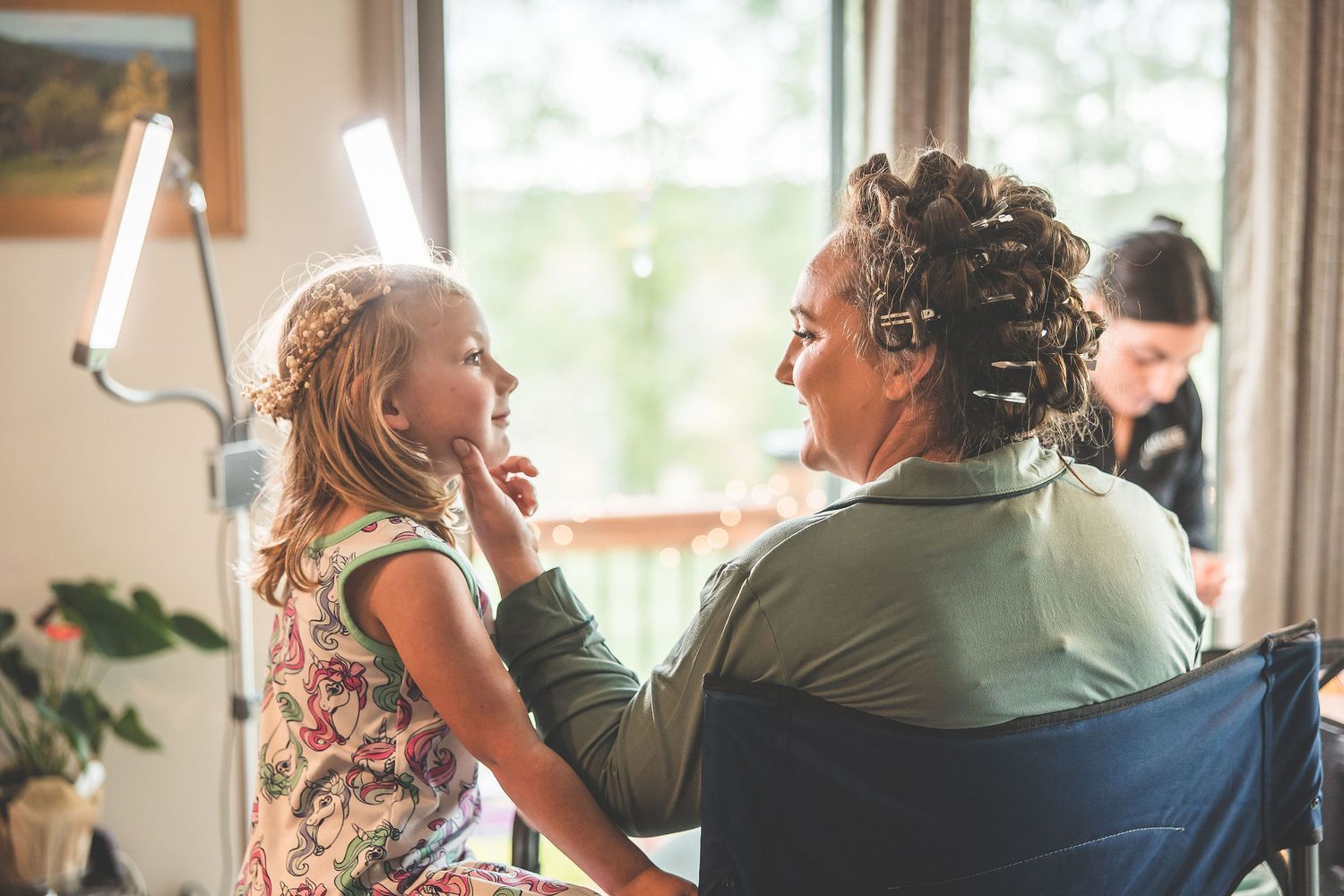 Natural light fills a room during wedding day preparations and styling.