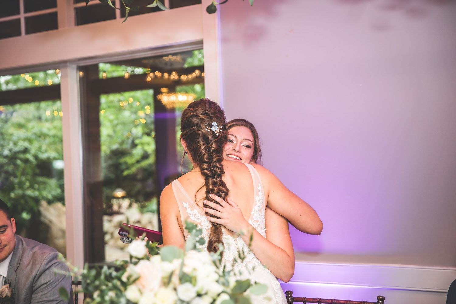 Wedding reception candid moments captured during dinner and speeches.