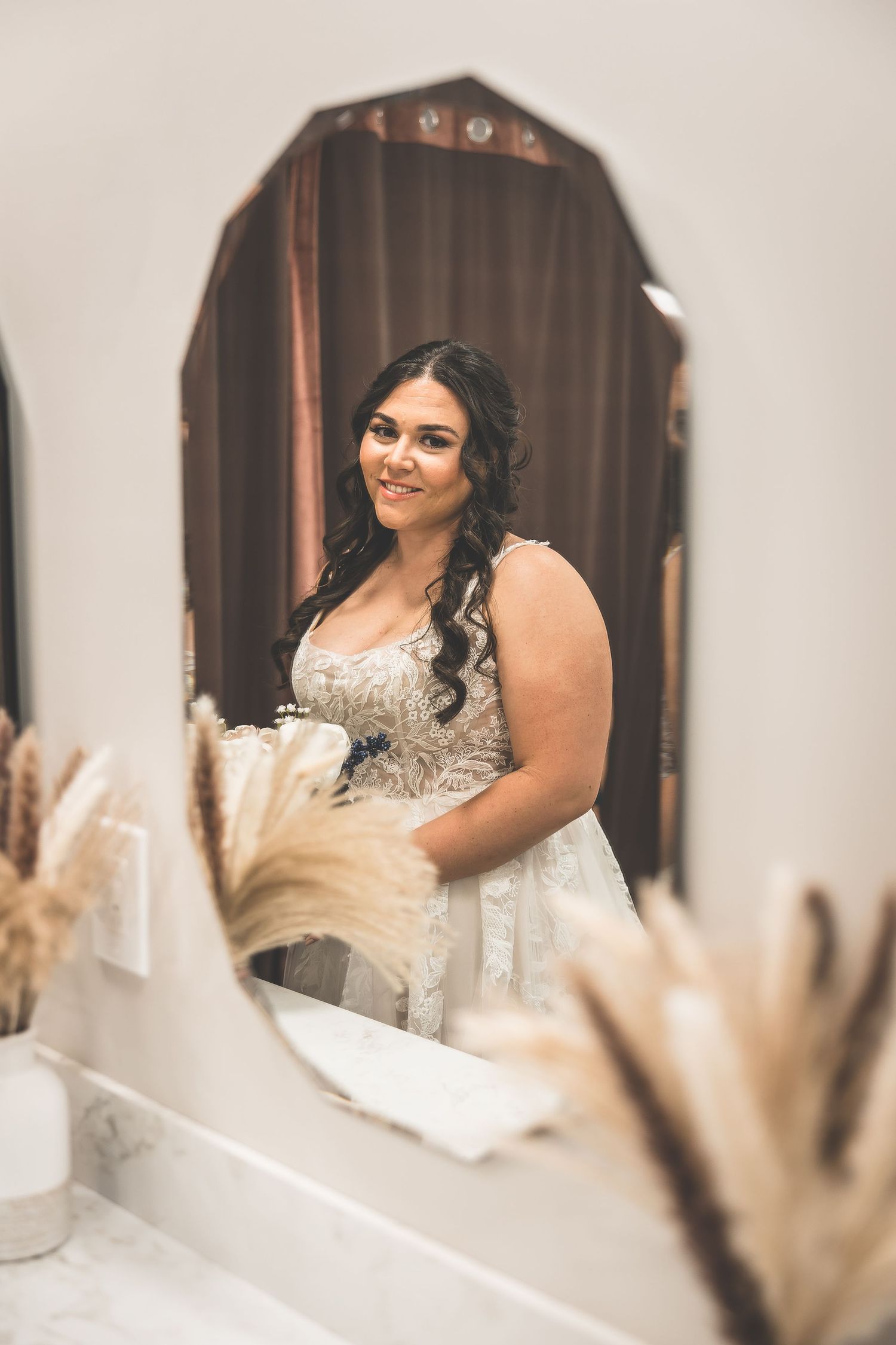 Close-up shots of a bride in an elegant beaded wedding gown with a sweetheart neckline.