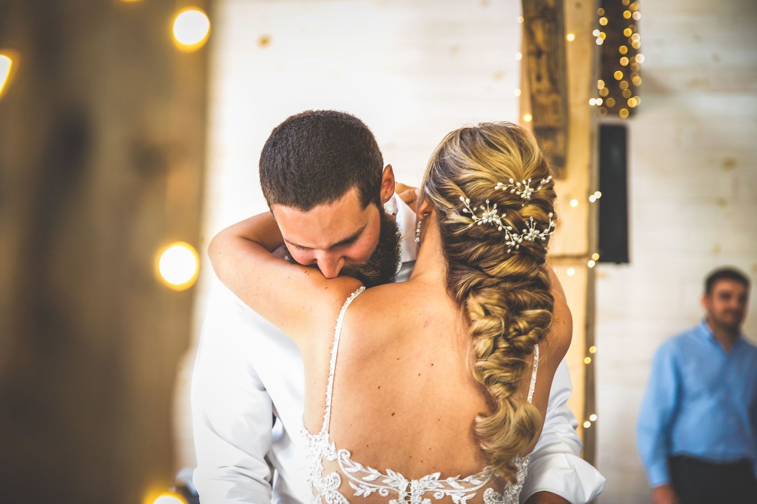 Intimate close-up of a couple embracing during their wedding dance.