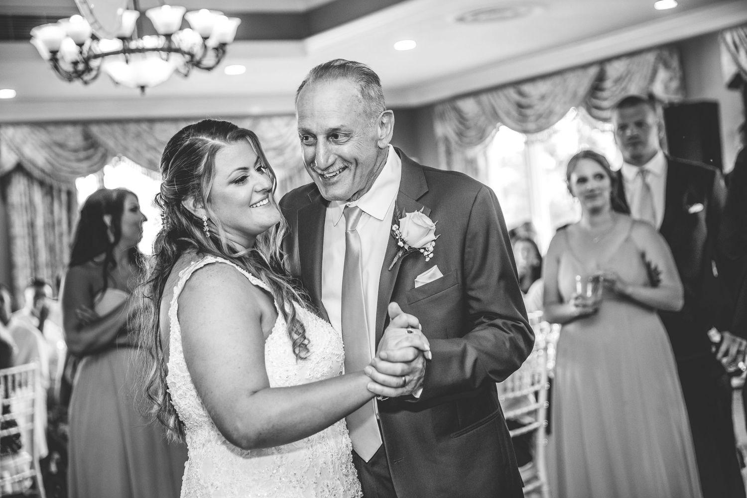 Black and white photo of wedding reception dancing and celebrations.