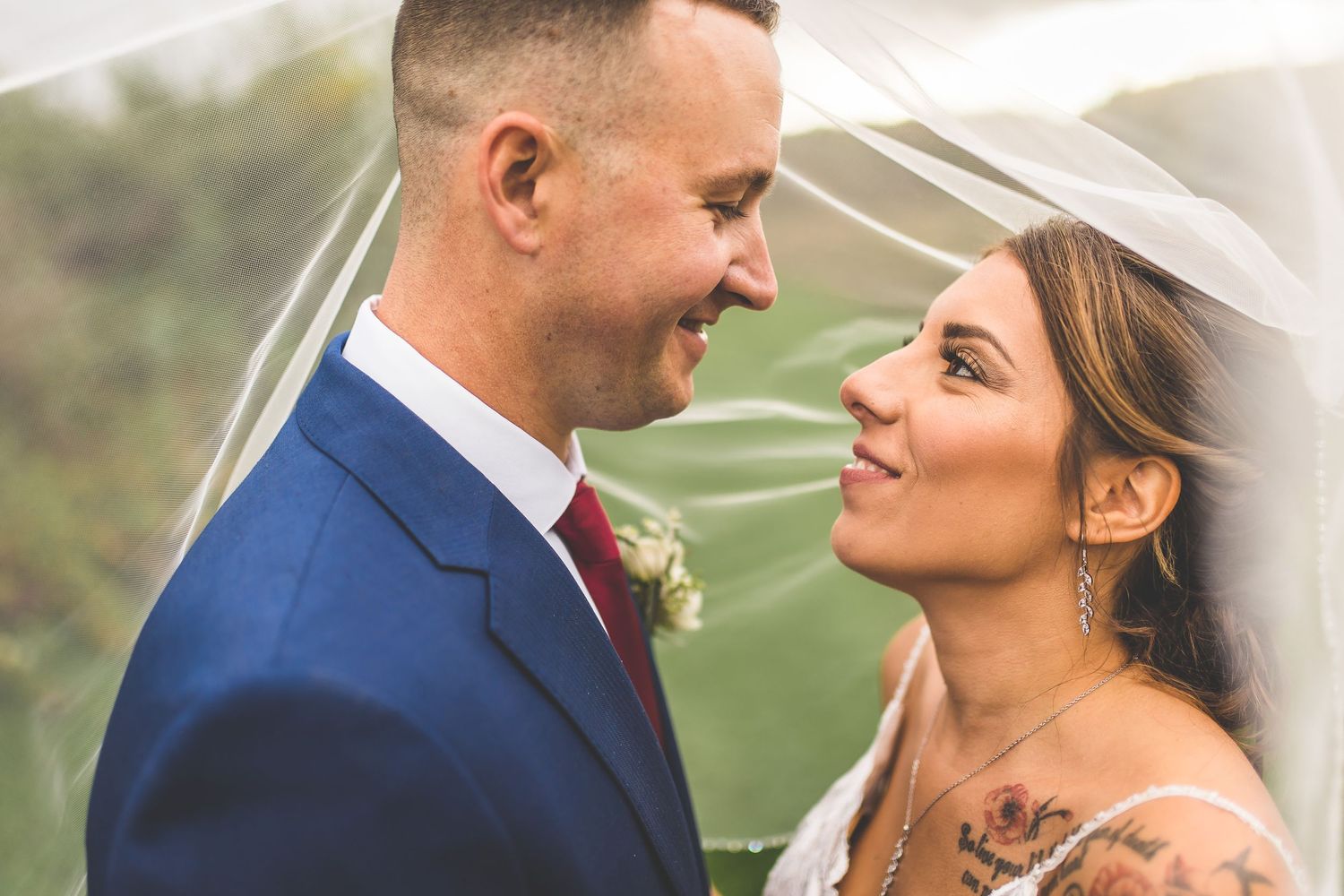 Close-up wedding portraits showcase tender moments between newlyweds.