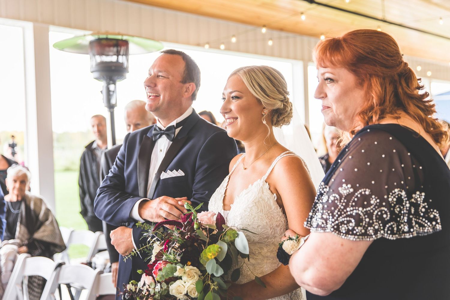 Wedding reception guests enjoying the celebration in an elegantly decorated venue.