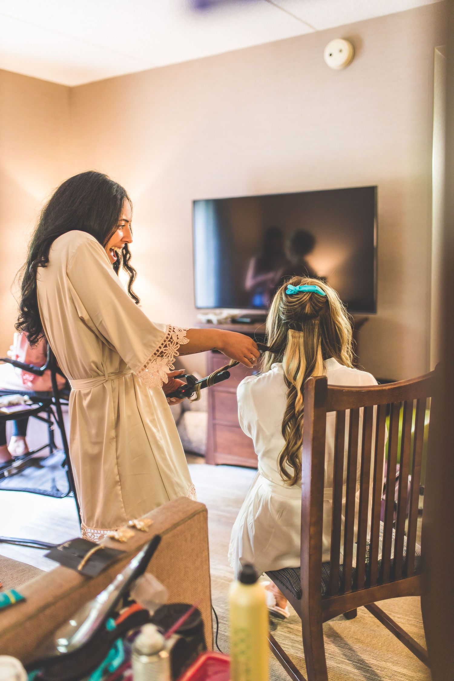 Wedding morning preparation scenes with bridesmaids in matching robes.