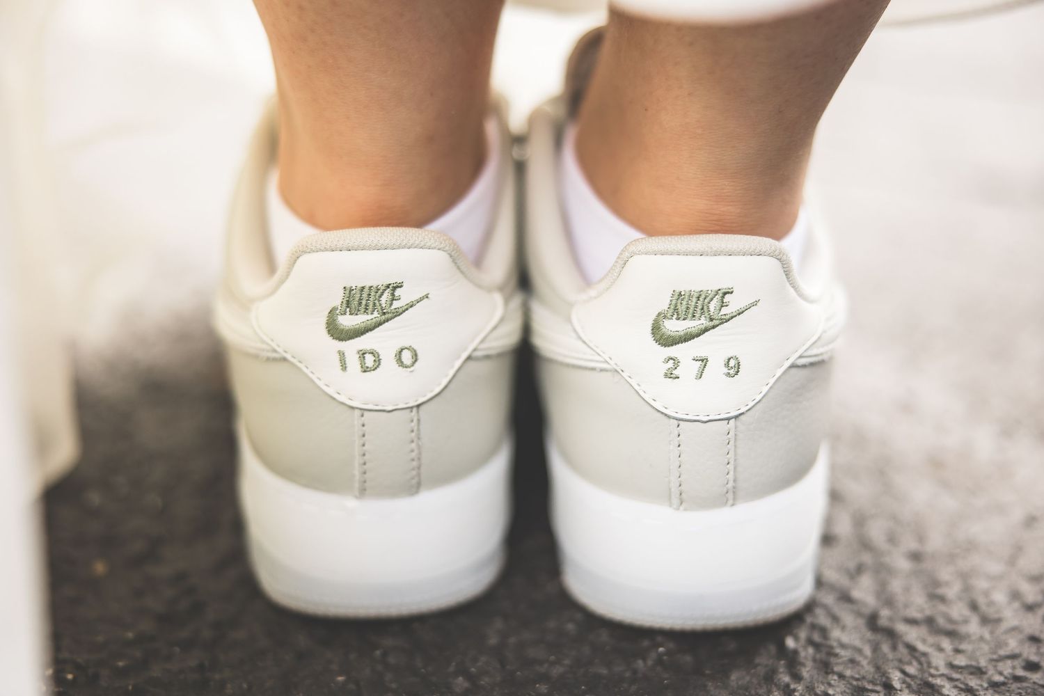 White Nike sneakers worn as wedding shoes, showing a creative and comfortable bridal footwear choice.
