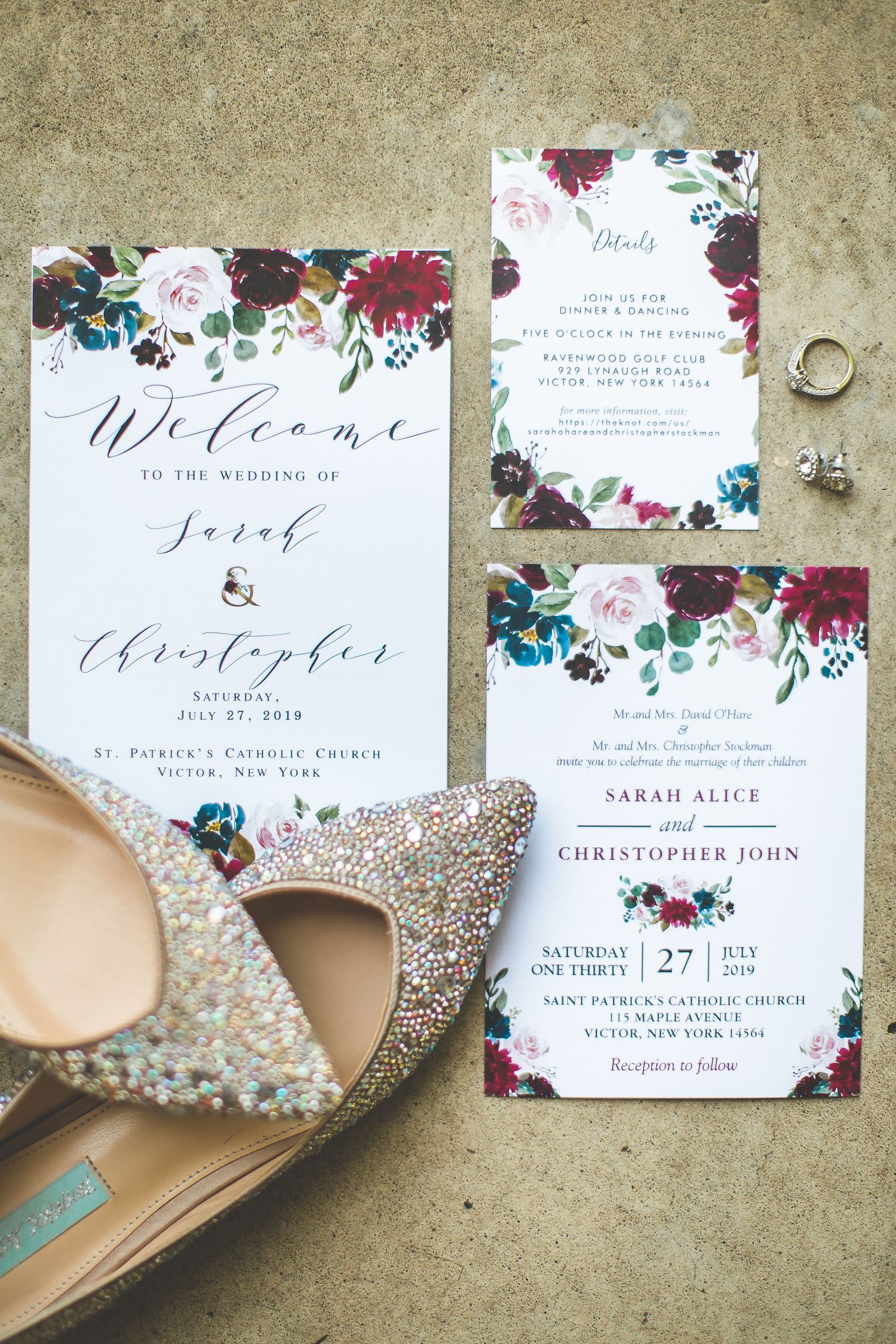 Elegant wedding invitation suite with burgundy floral design and sparkly bridal shoes.