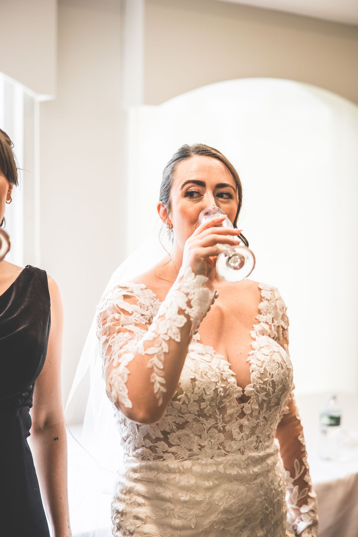 Joyful candid moments of bride and bridesmaids during wedding preparations.