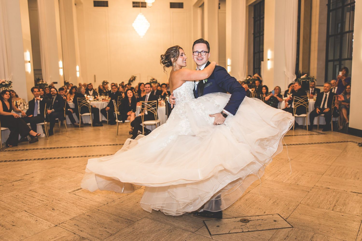 Ballroom dance sequence shows flowing movement in grand reception venue.