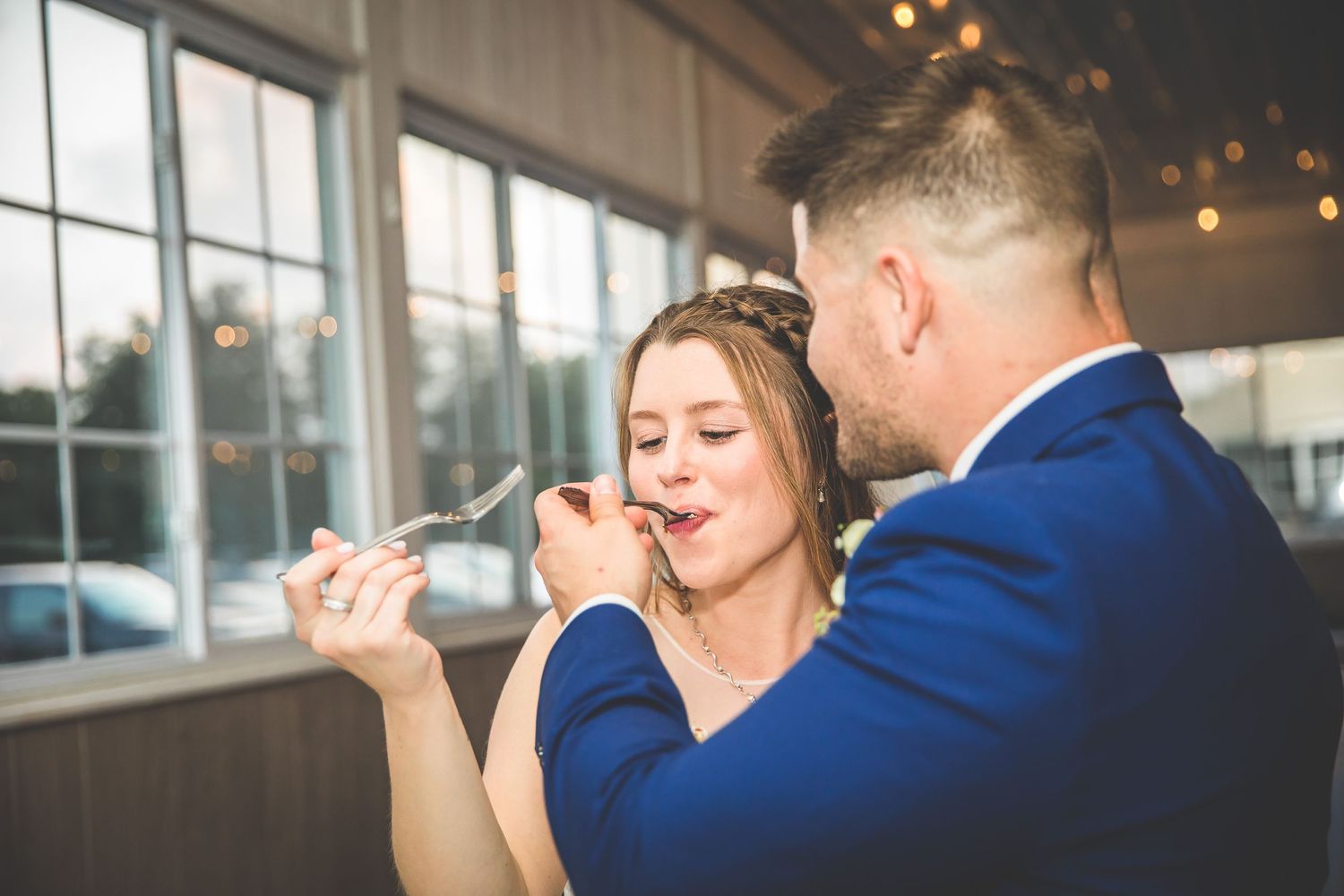 Intimate reception moments captured under warm indoor lighting.