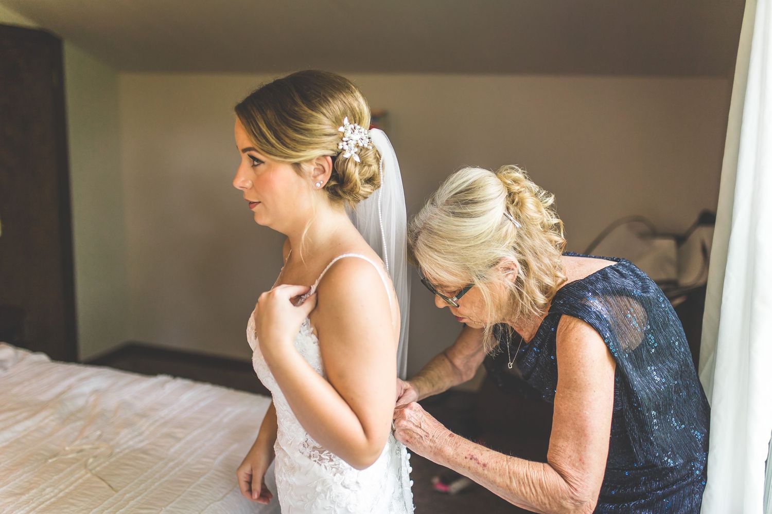 Wedding preparation scene in a sunlit room.