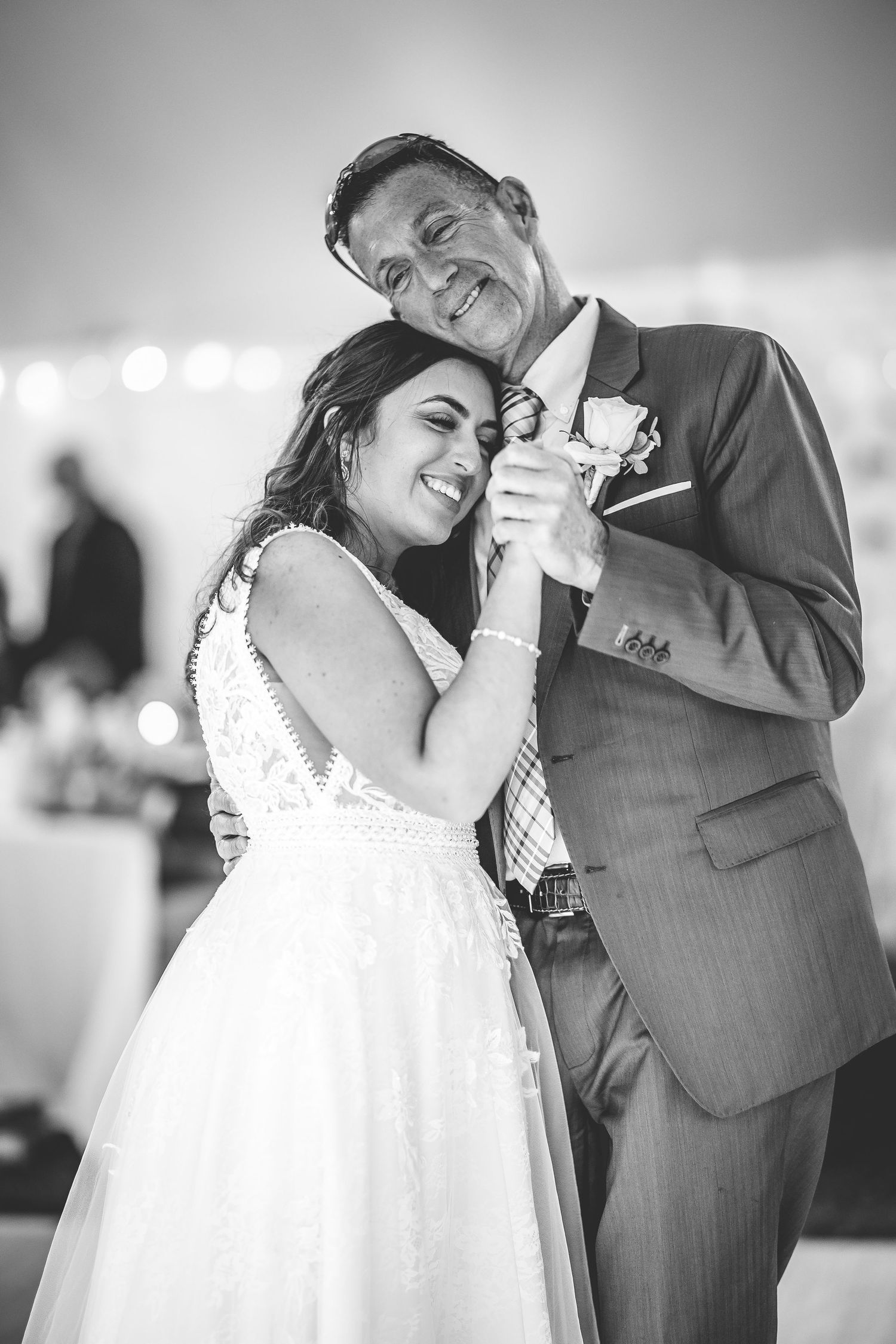 Black and white images show tender moments between dancing newlyweds.