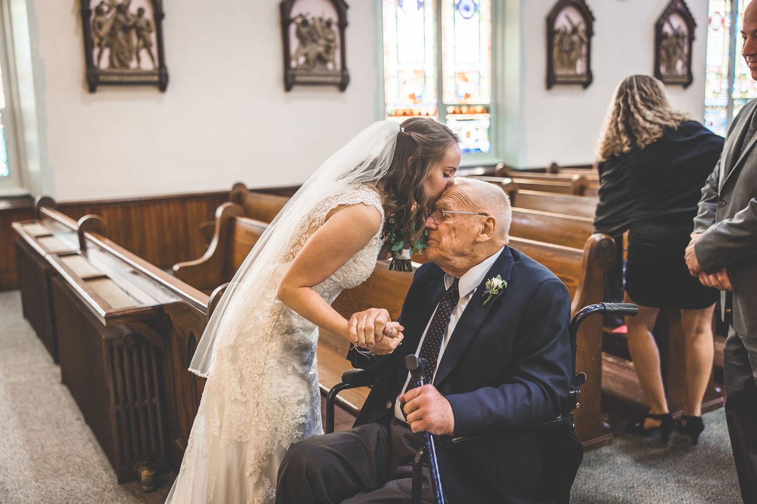 Wedding ceremony candid moments captured inside a traditional church setting.