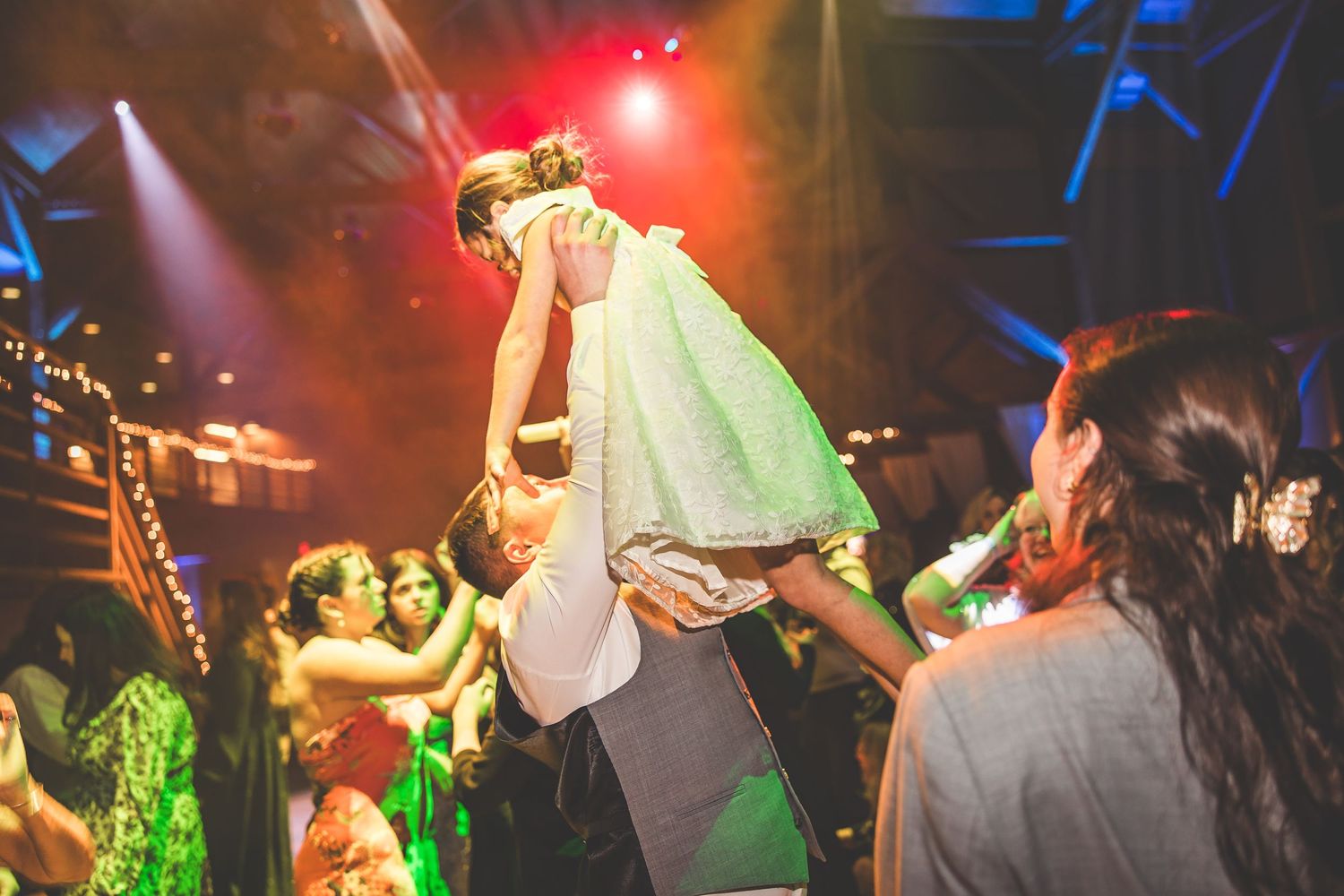 Dance party with dramatic red and blue lighting effects creating an energetic atmosphere.