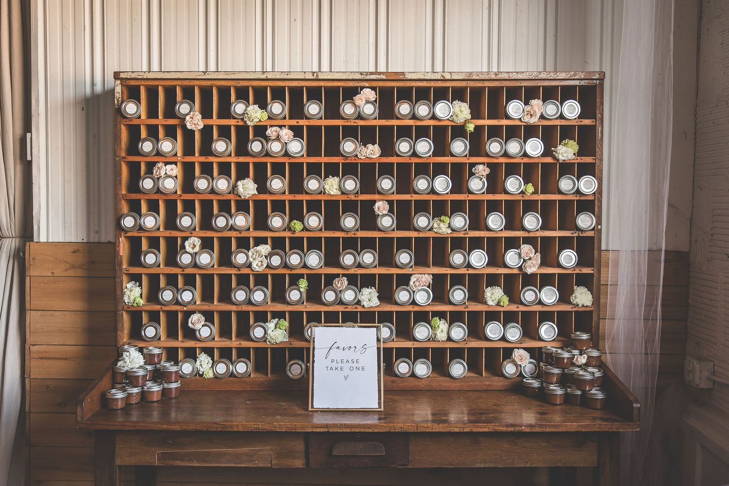 Wall-mounted wine glass storage rack filled with hanging stemware in organized rows.