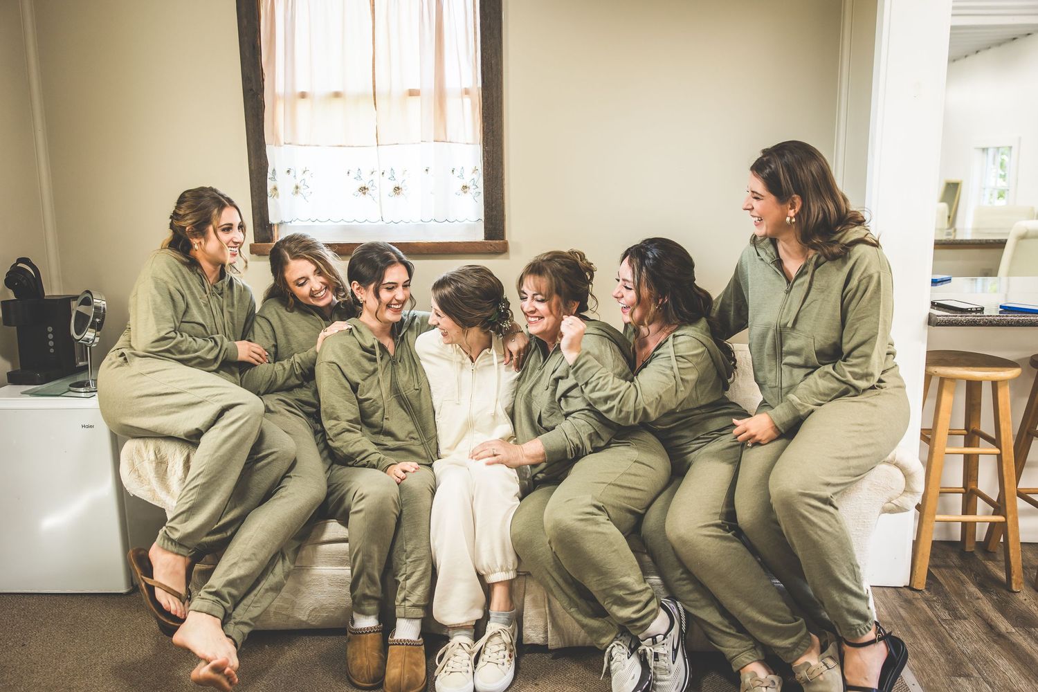 Group photo showing celebration and laughter while wearing coordinated outfits.