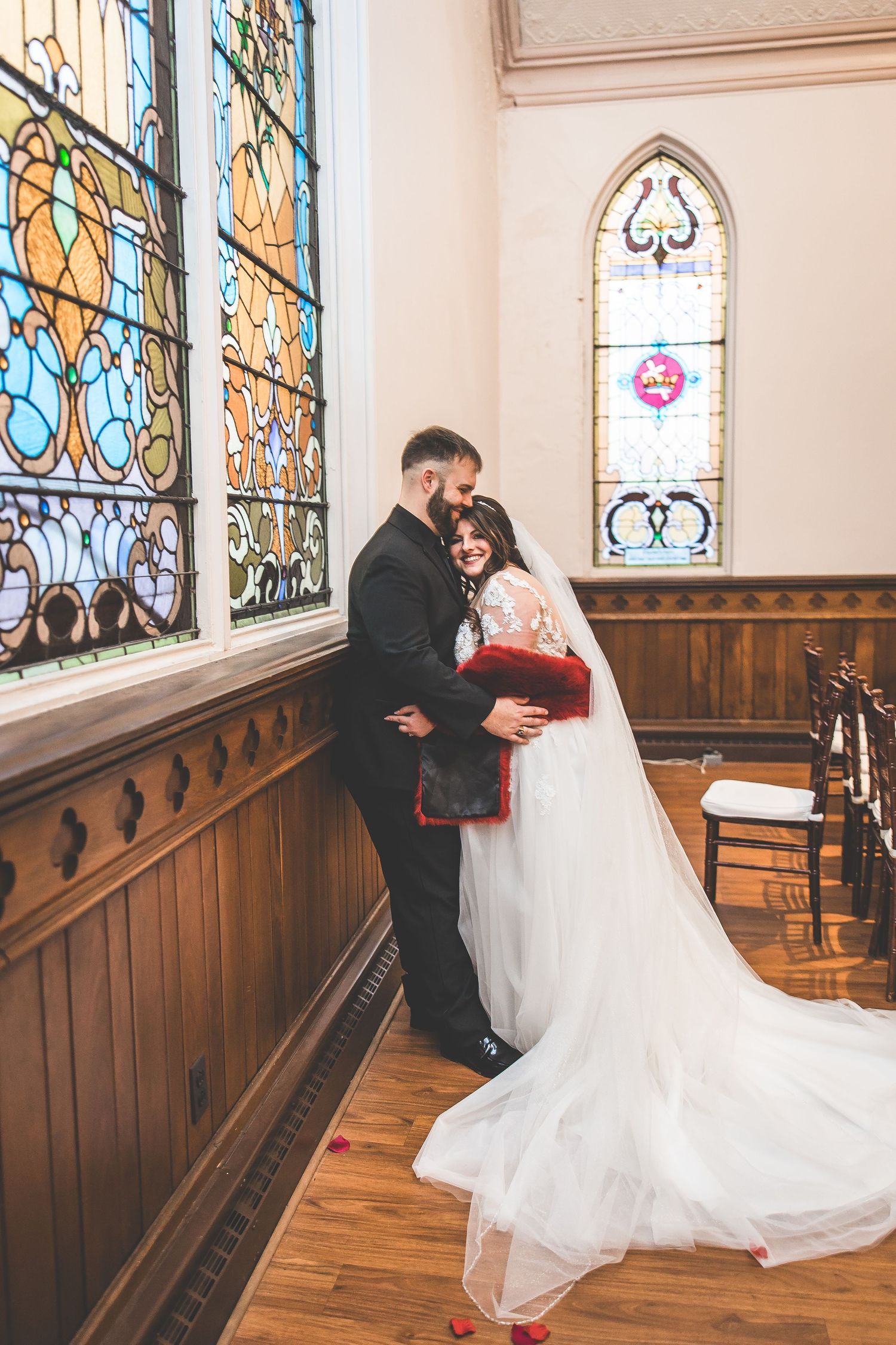 Romantic dance sequence in front of beautiful stained glass windows in a church setting.