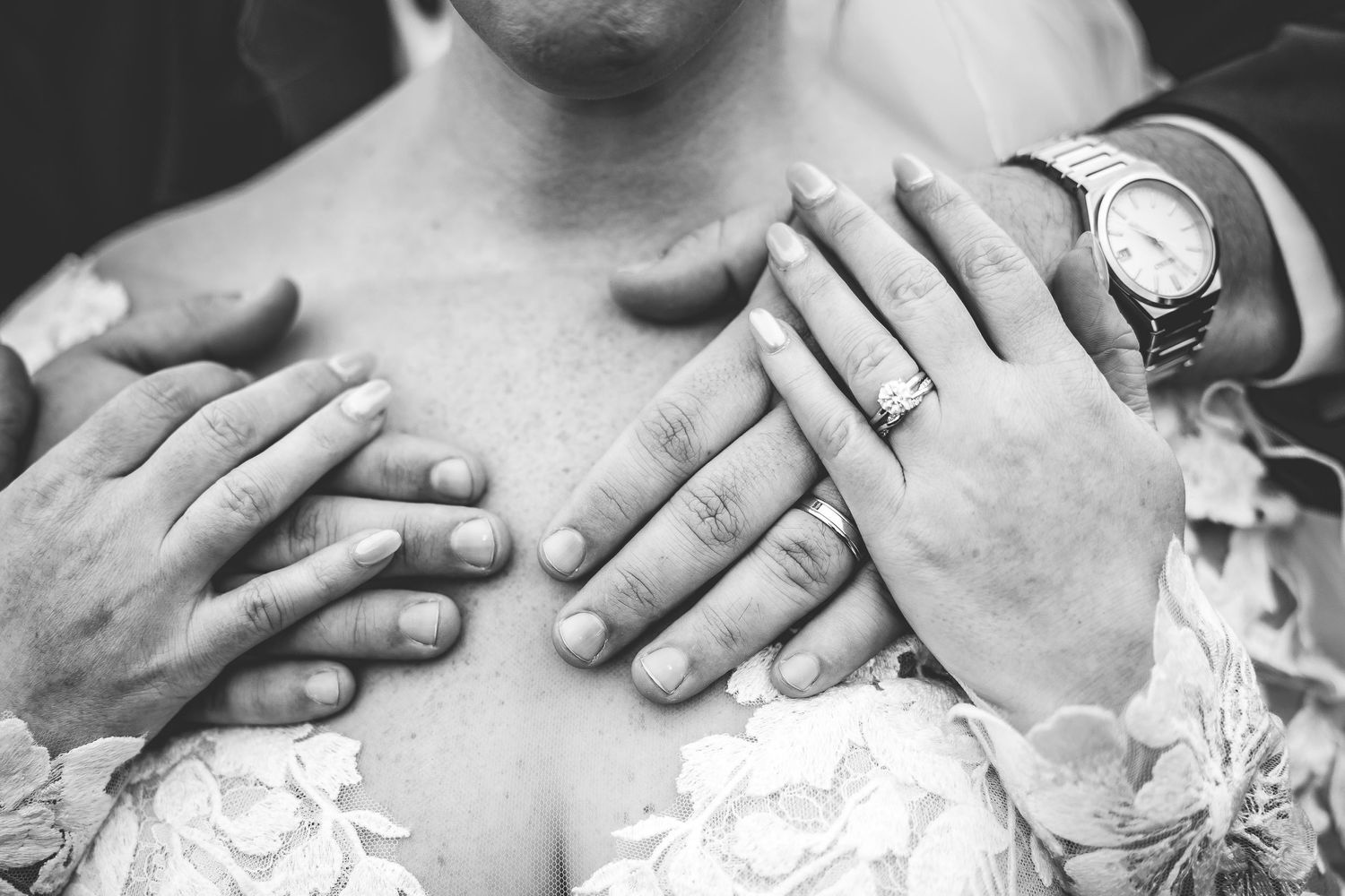 Close-up shots of wedding rings and lace details on a bridal gown.