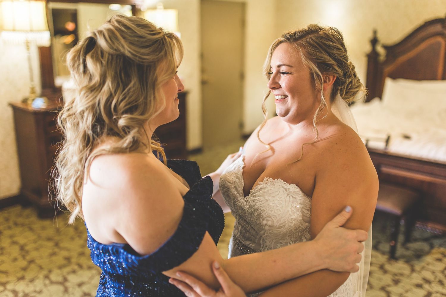 Wedding party celebrating and sharing joyful moments during preparations.