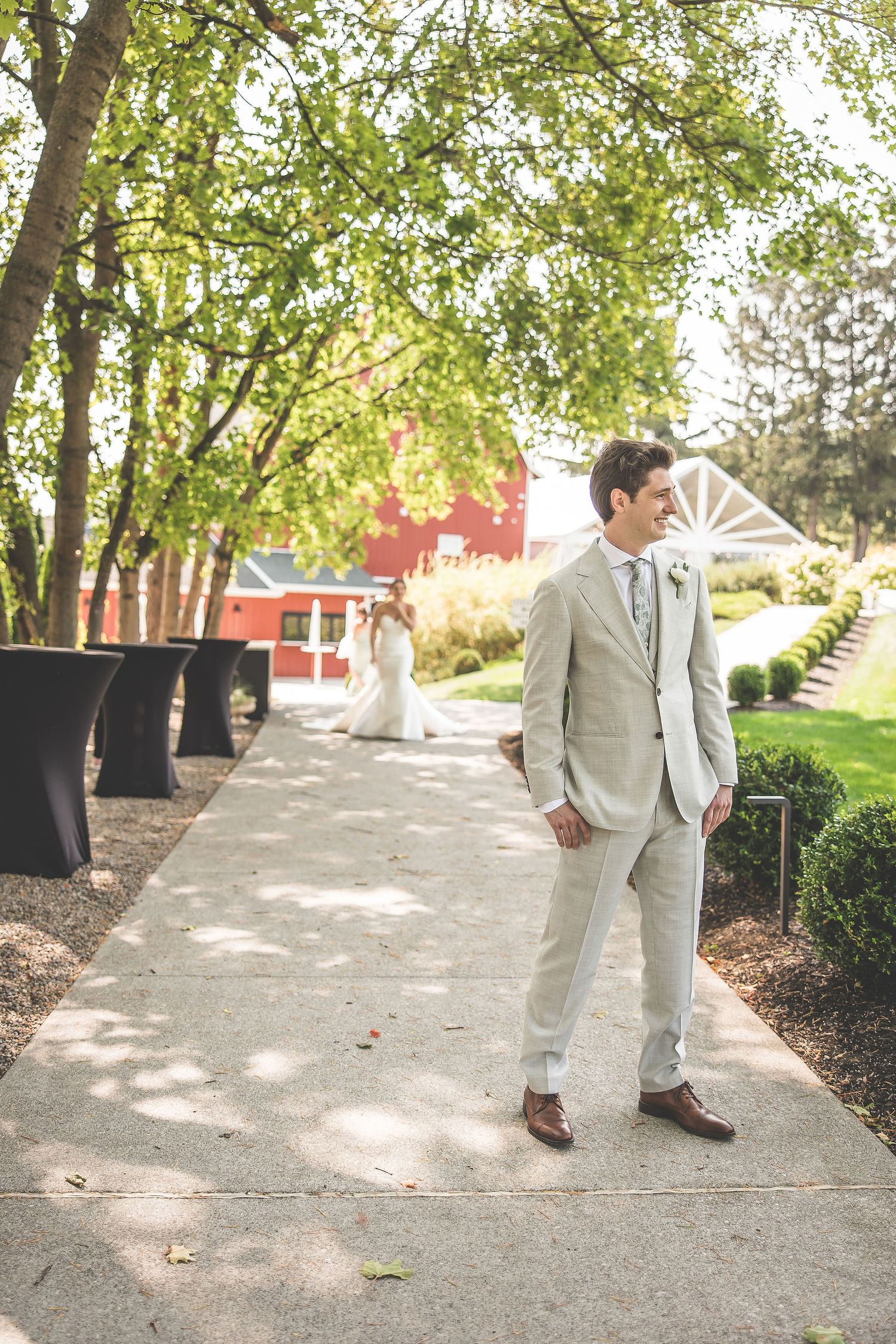 A series of candid wedding photos taken on a tree-lined path with dappled sunlight.