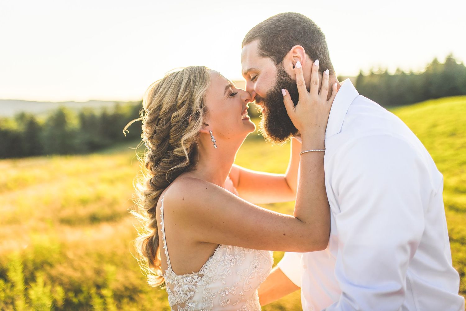 Intimate golden hour wedding portraits in a scenic mountain setting.