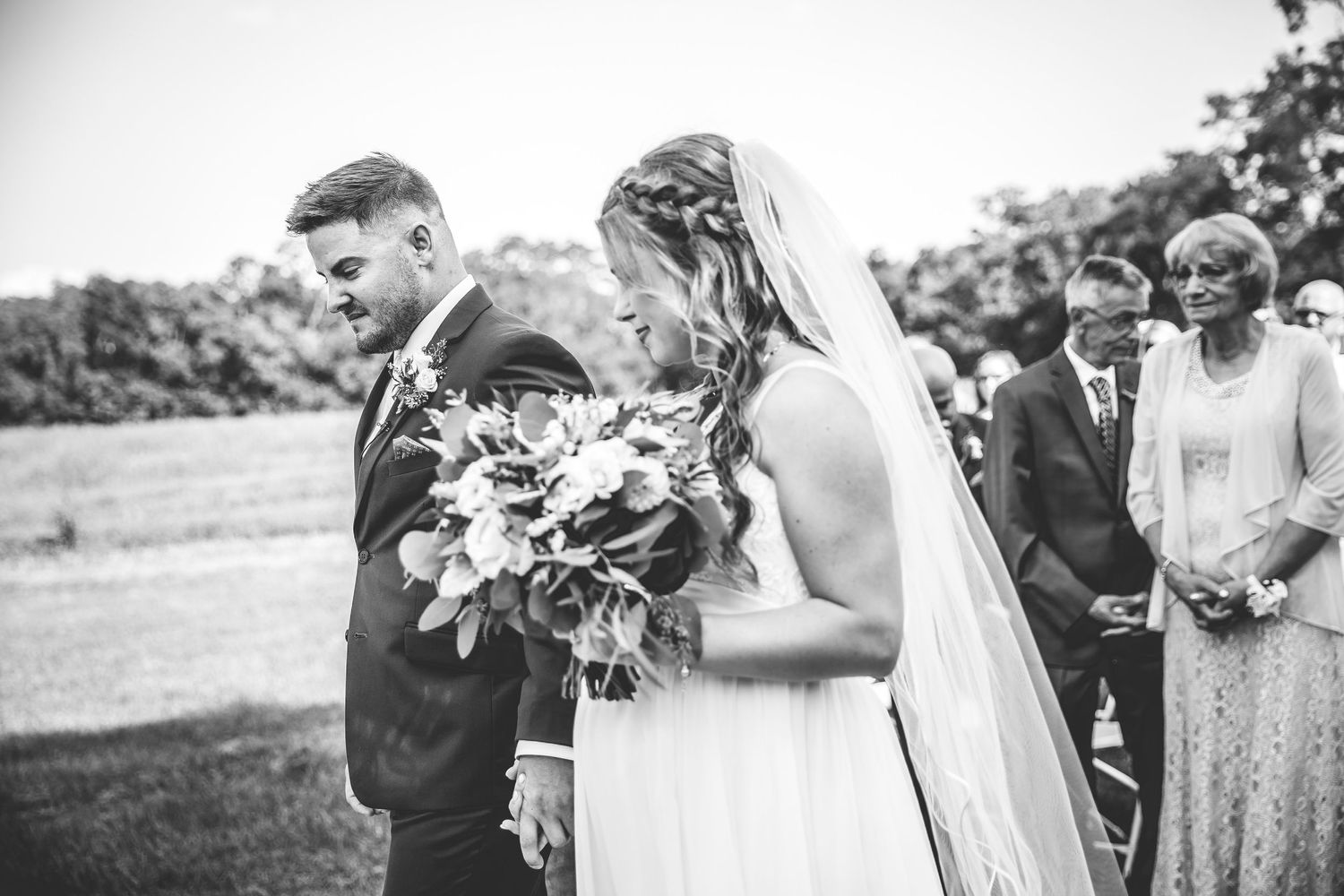Outdoor wedding ceremony moments captured in a series of candid shots.