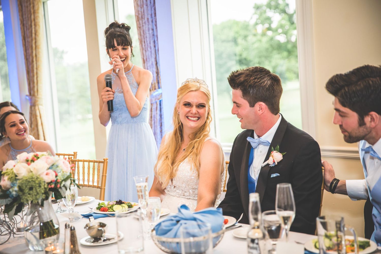 Candid moments captured during wedding reception dinner with guests in formal attire.
