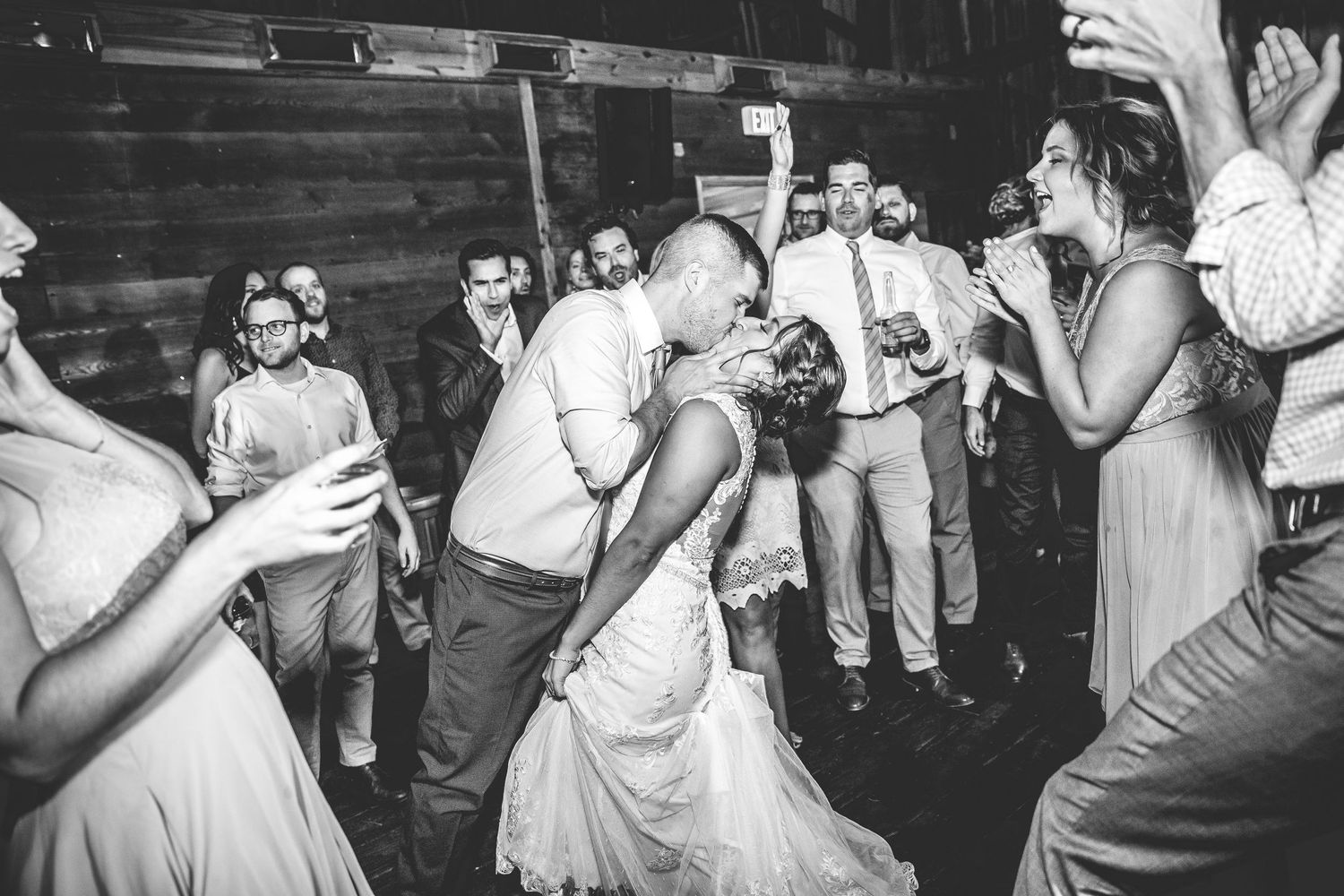 Black and white photo of wedding reception dance floor celebrations.