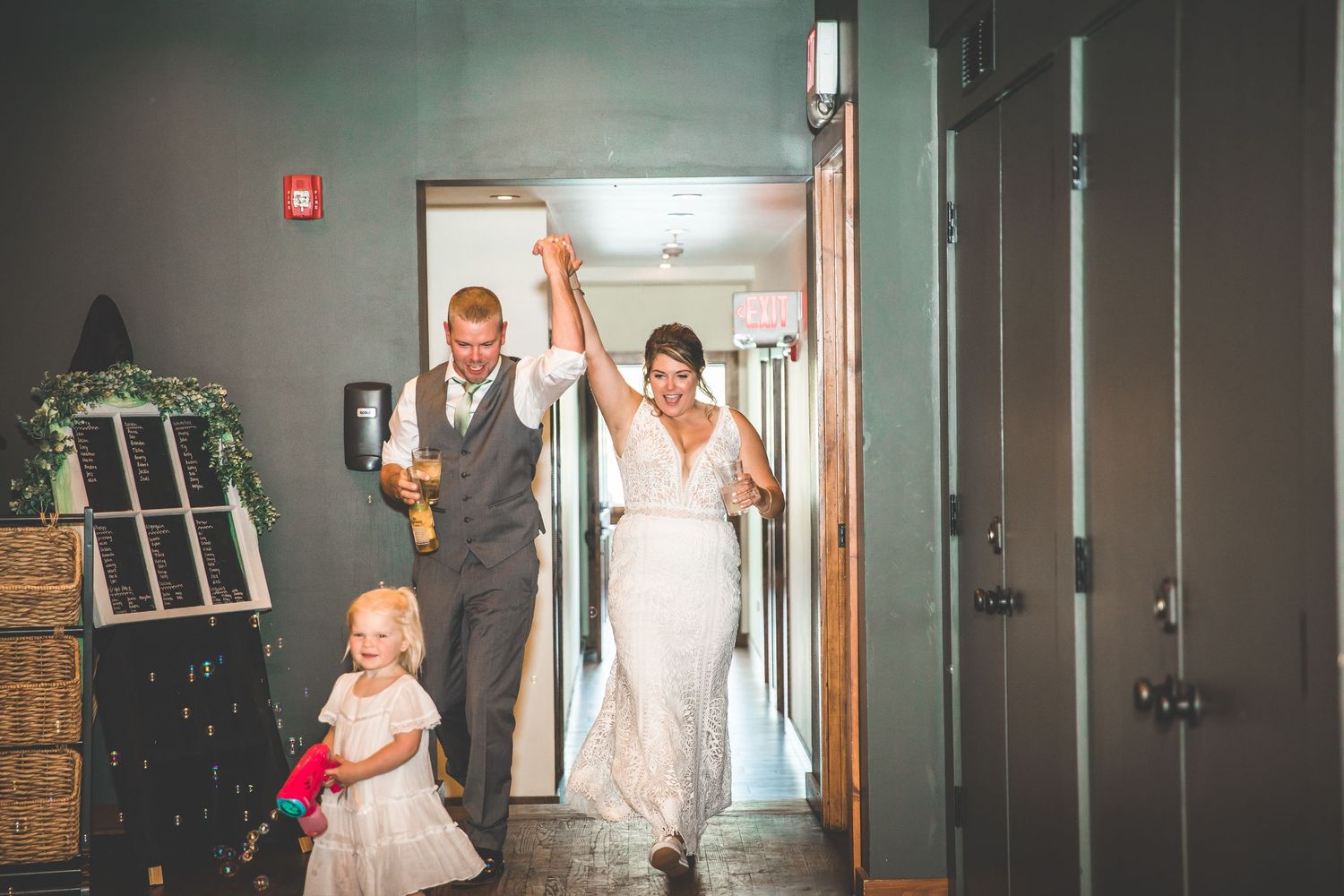 Interior hallway of a venue with dark walls and ambient lighting.