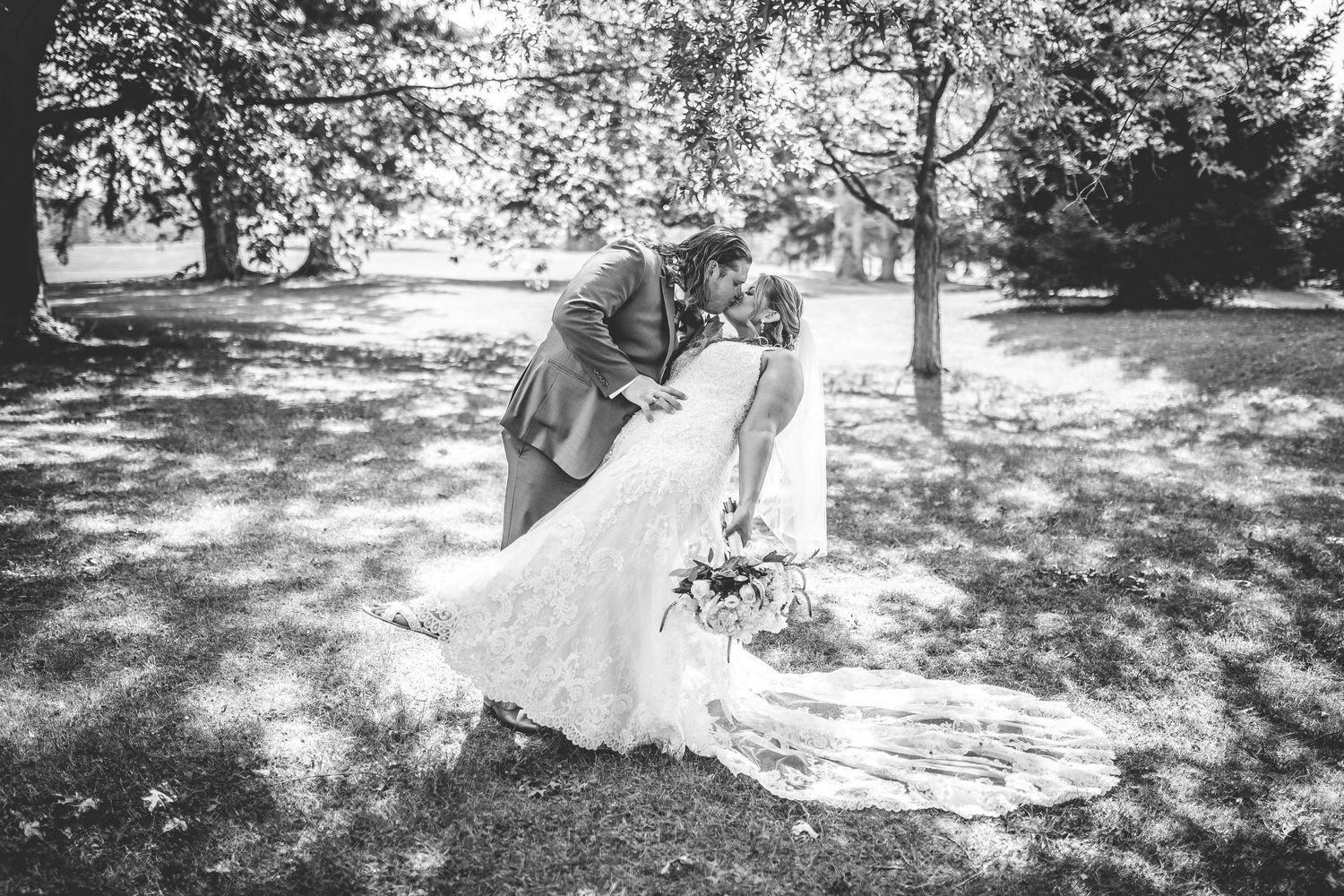 Artistic black and white wedding photo sequence showing couple's intimate moments.