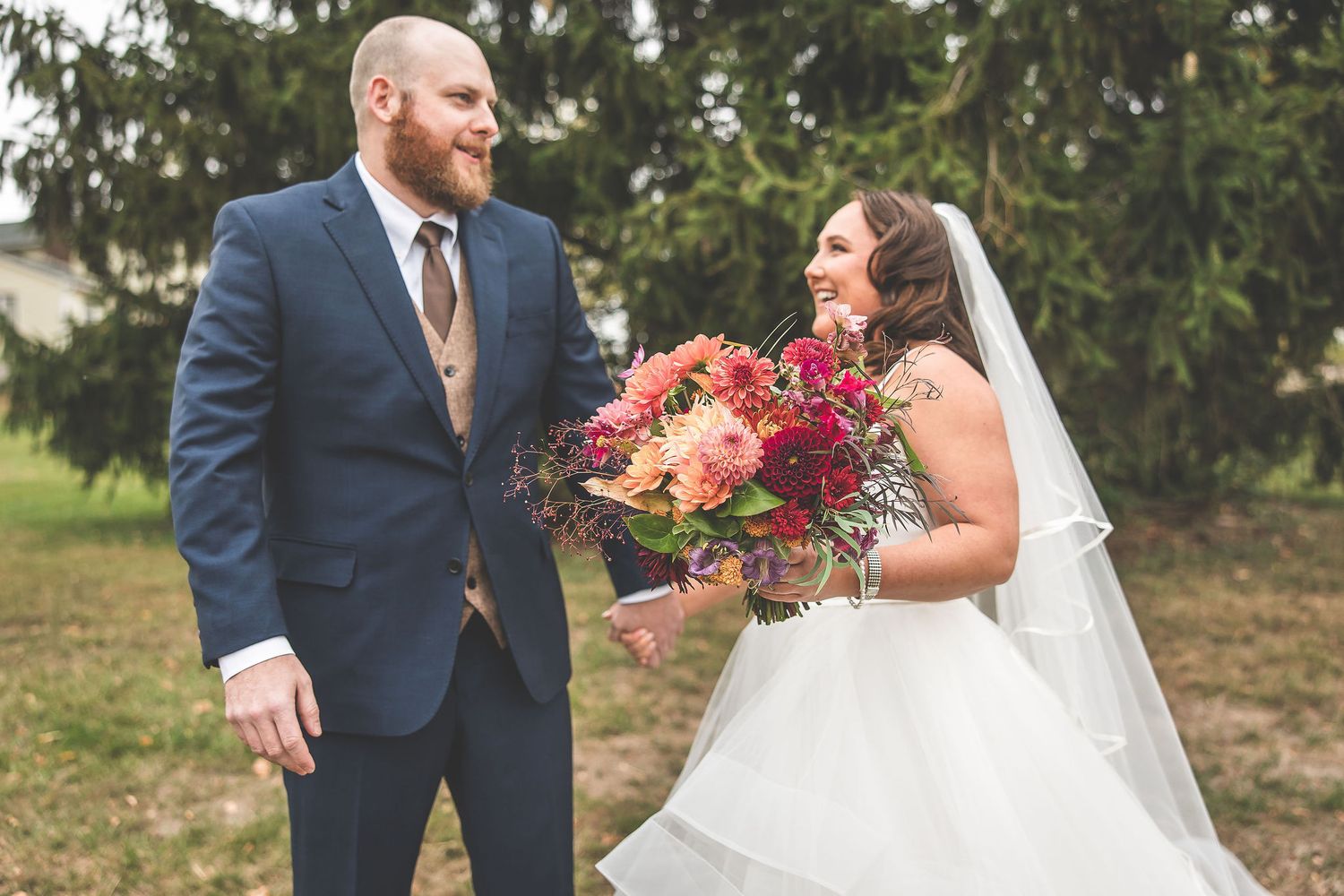 Newlyweds share intimate moments with their German Shepherd during fall wedding photos.