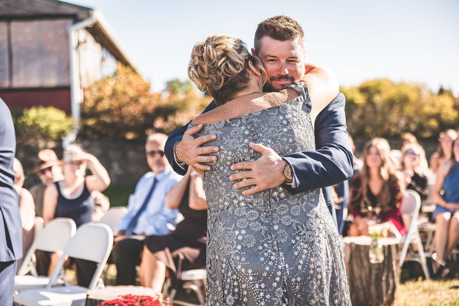 Emotional wedding ceremony moments captured during golden hour outdoors.