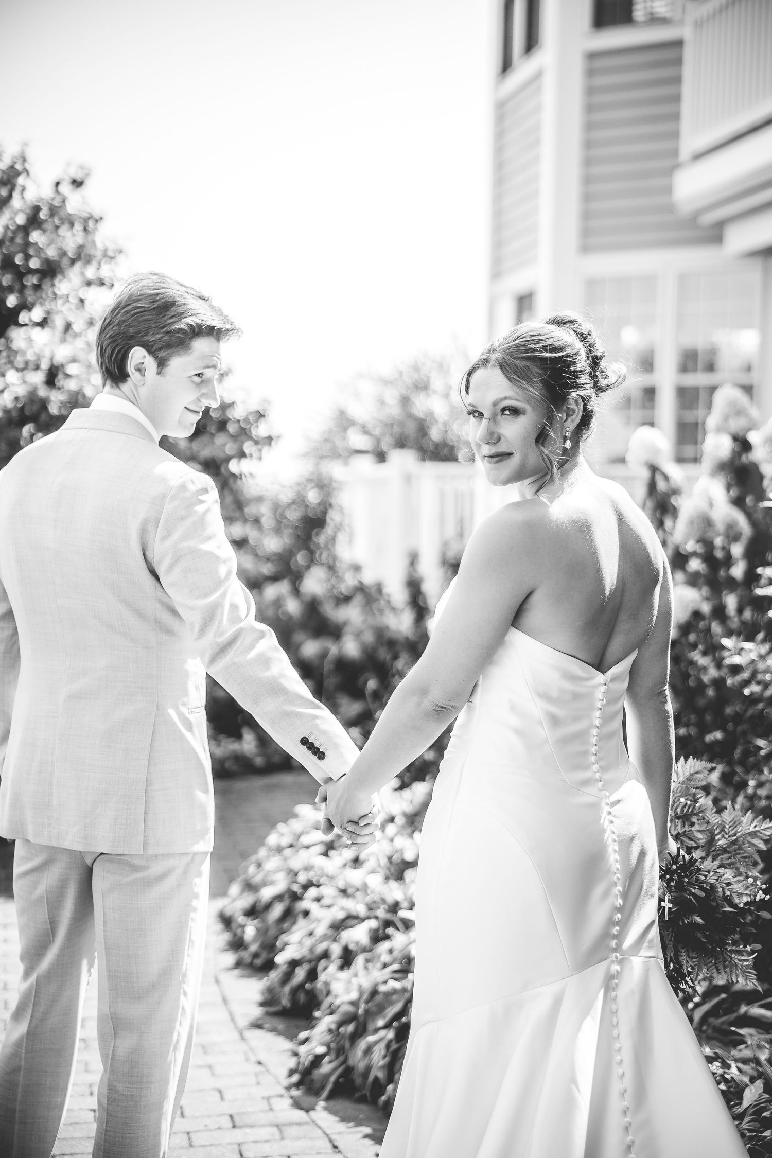 Artistic black and white sequence showing wedding couple's intimate moments outdoors.