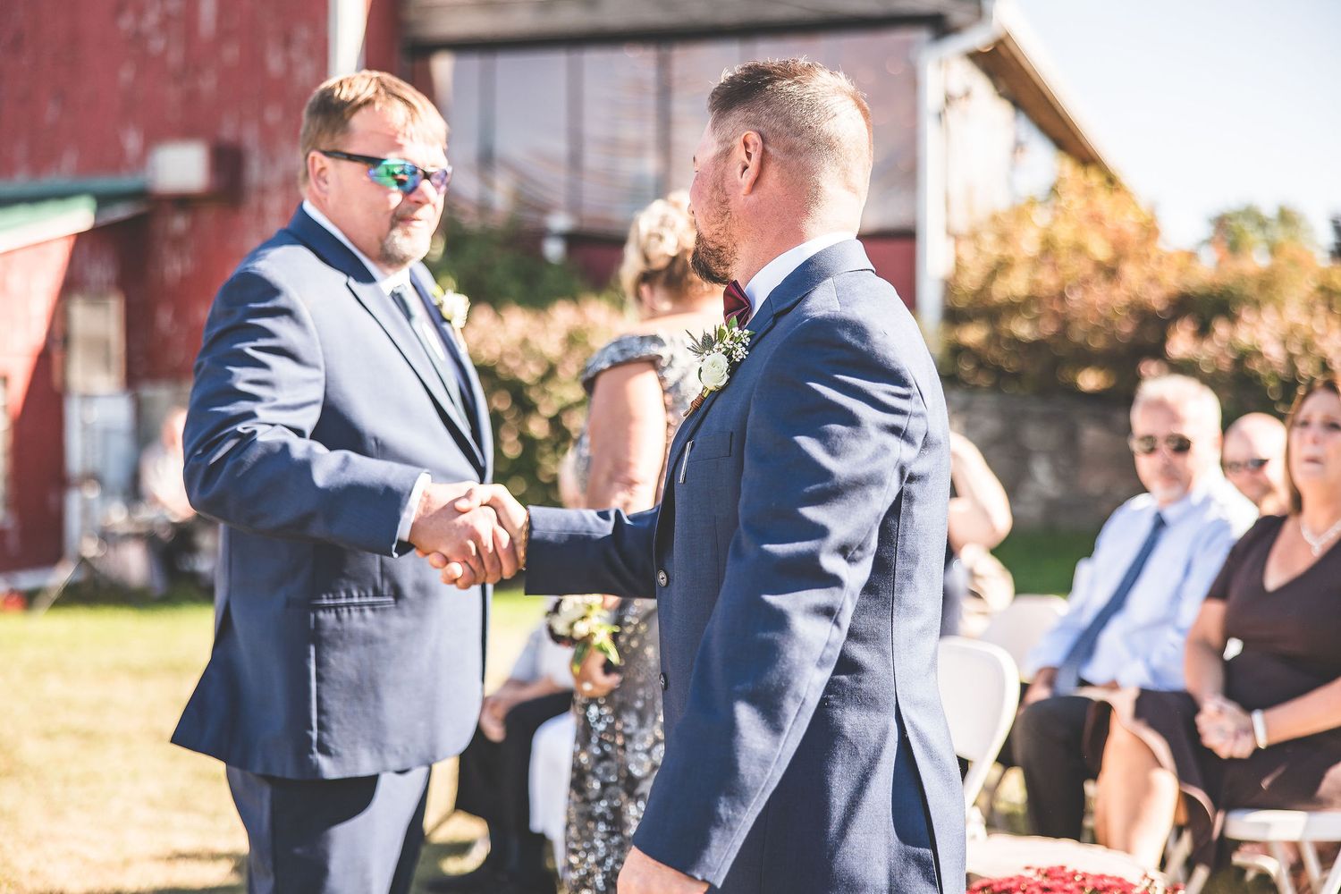 Wedding celebration candid moments captured outdoors during golden hour.