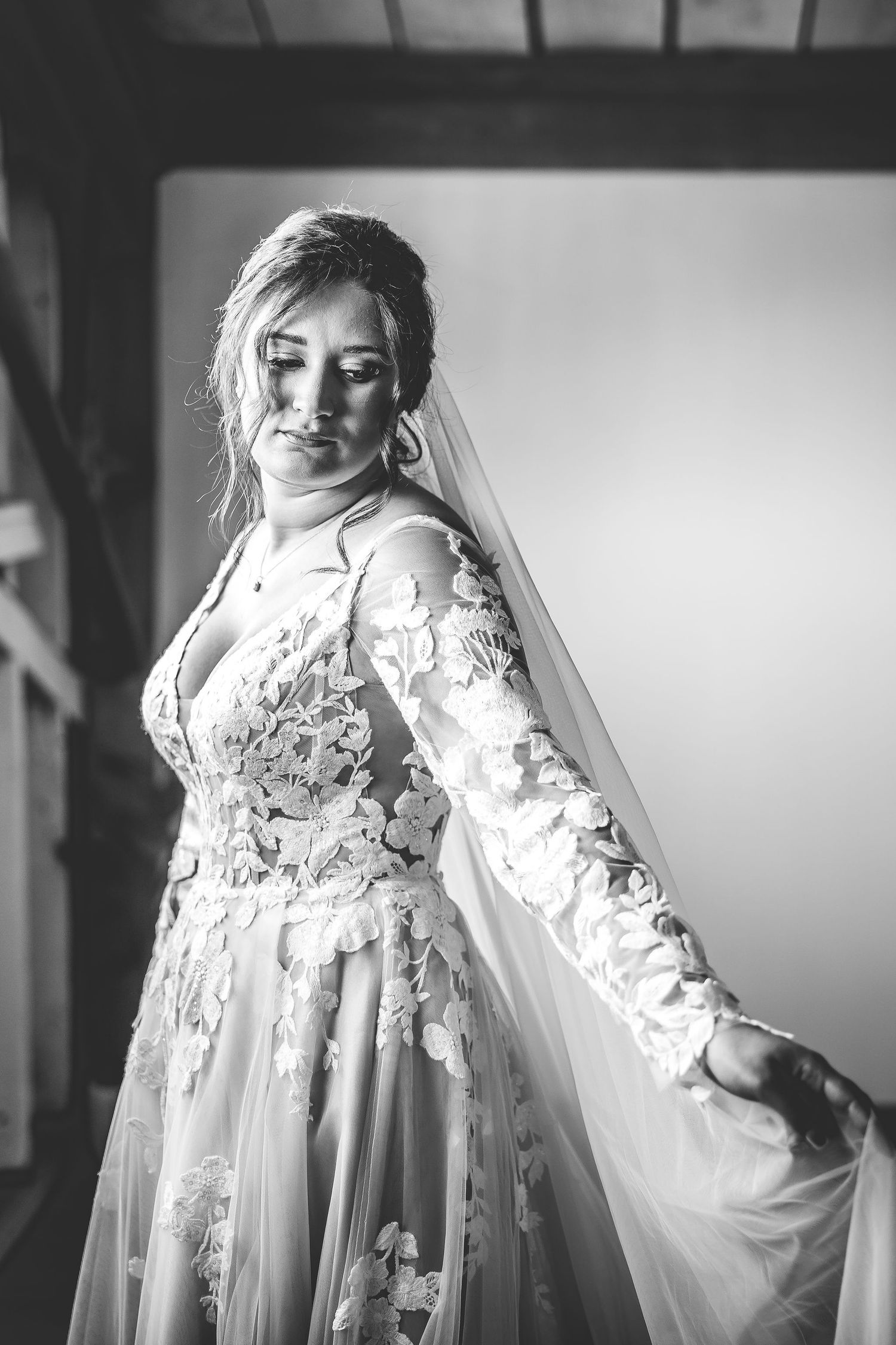 Artistic black and white series showing ethereal bridal portraits with flowing veil.