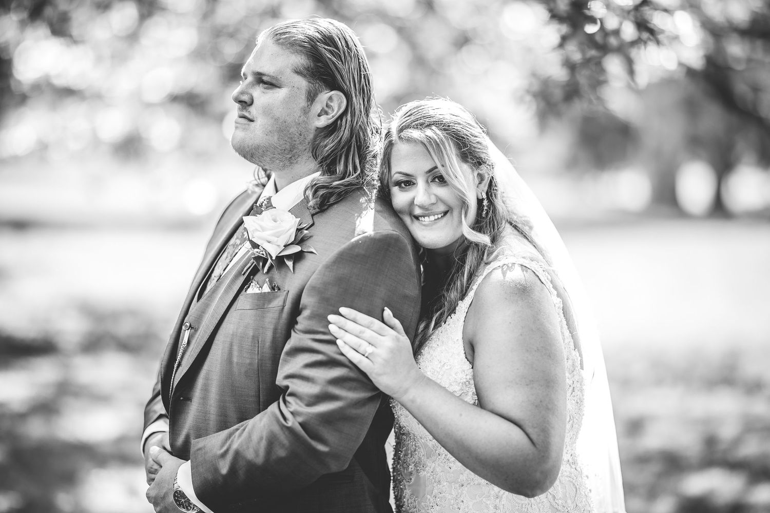 Candid black and white sequence of newlyweds sharing tender moments.