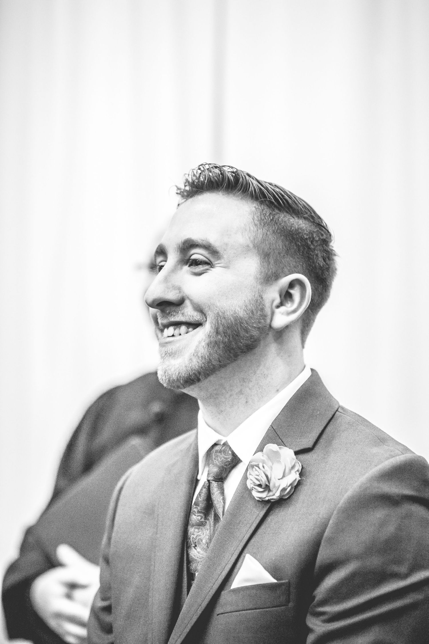 Black and white portrait series showing joyful expressions and laughter.