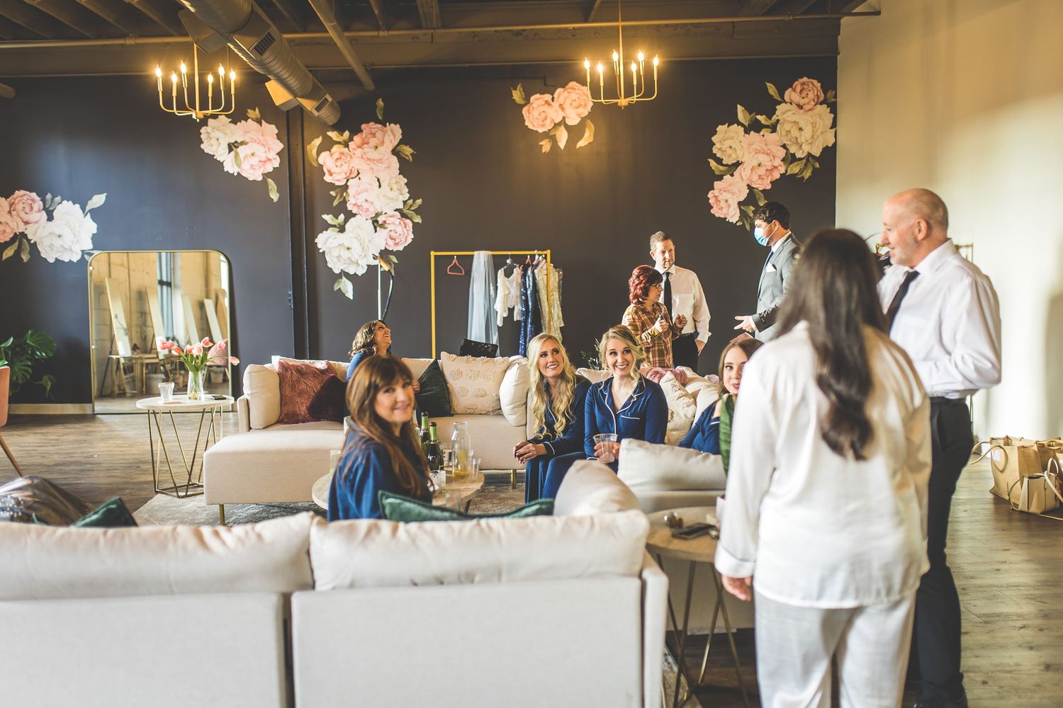 Modern wedding venue with elegant table settings and floral decorations.