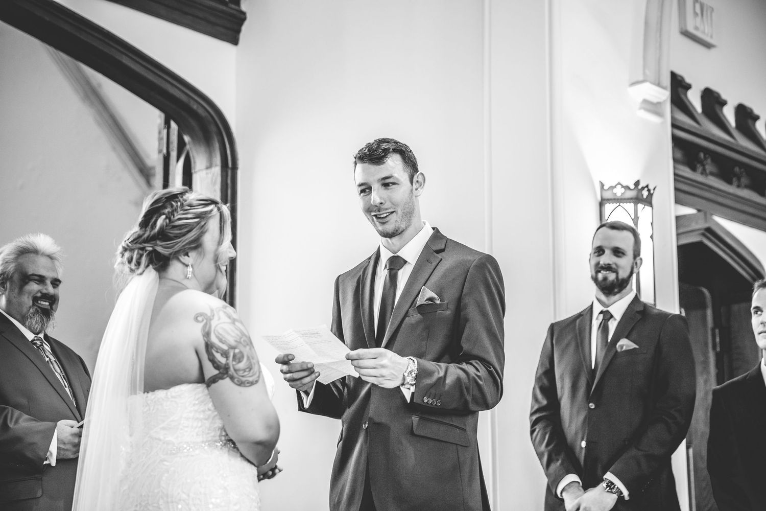 Black and white candid moments from a church wedding ceremony.