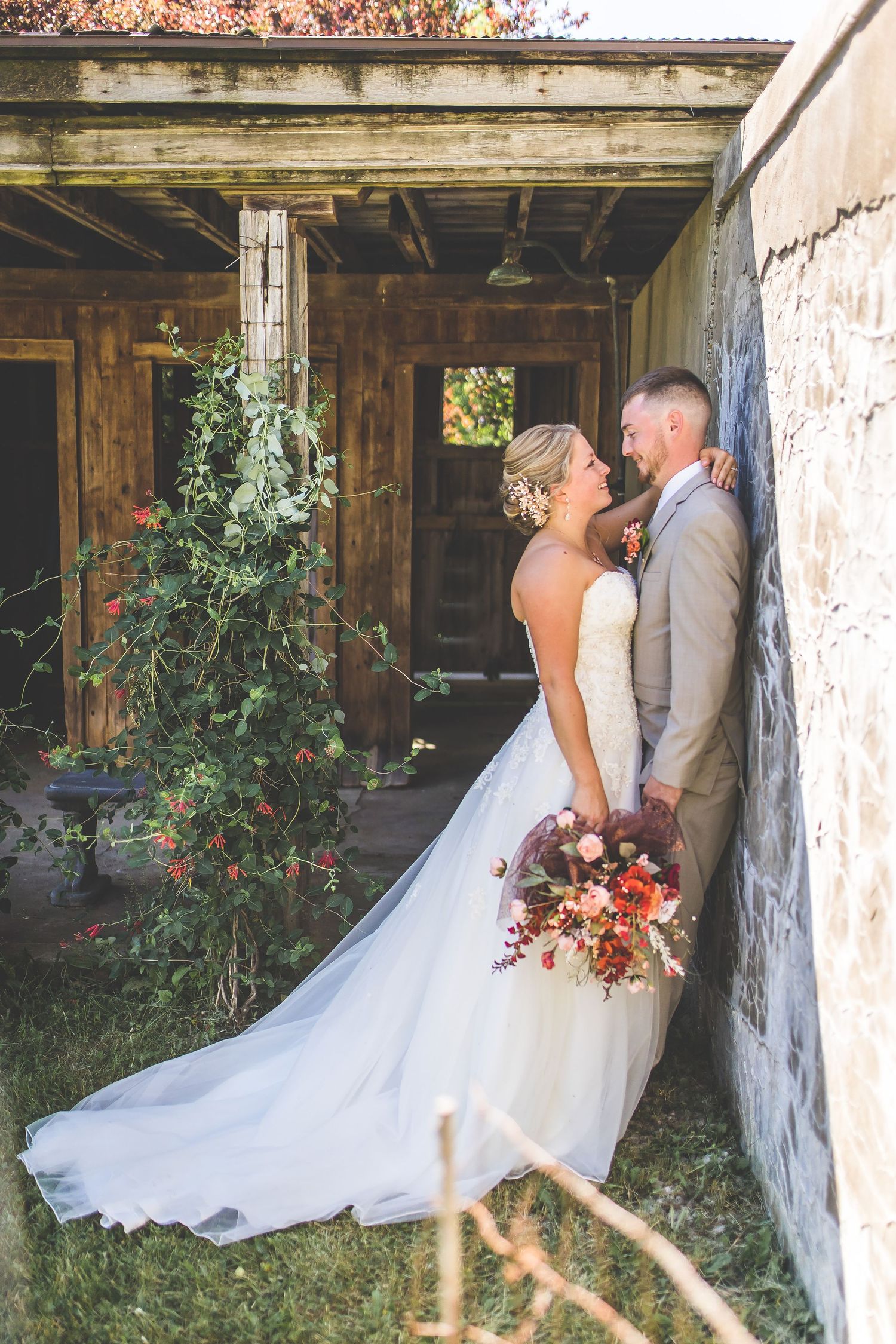 Wedding photos taken in a rustic stone building with natural light streaming through.