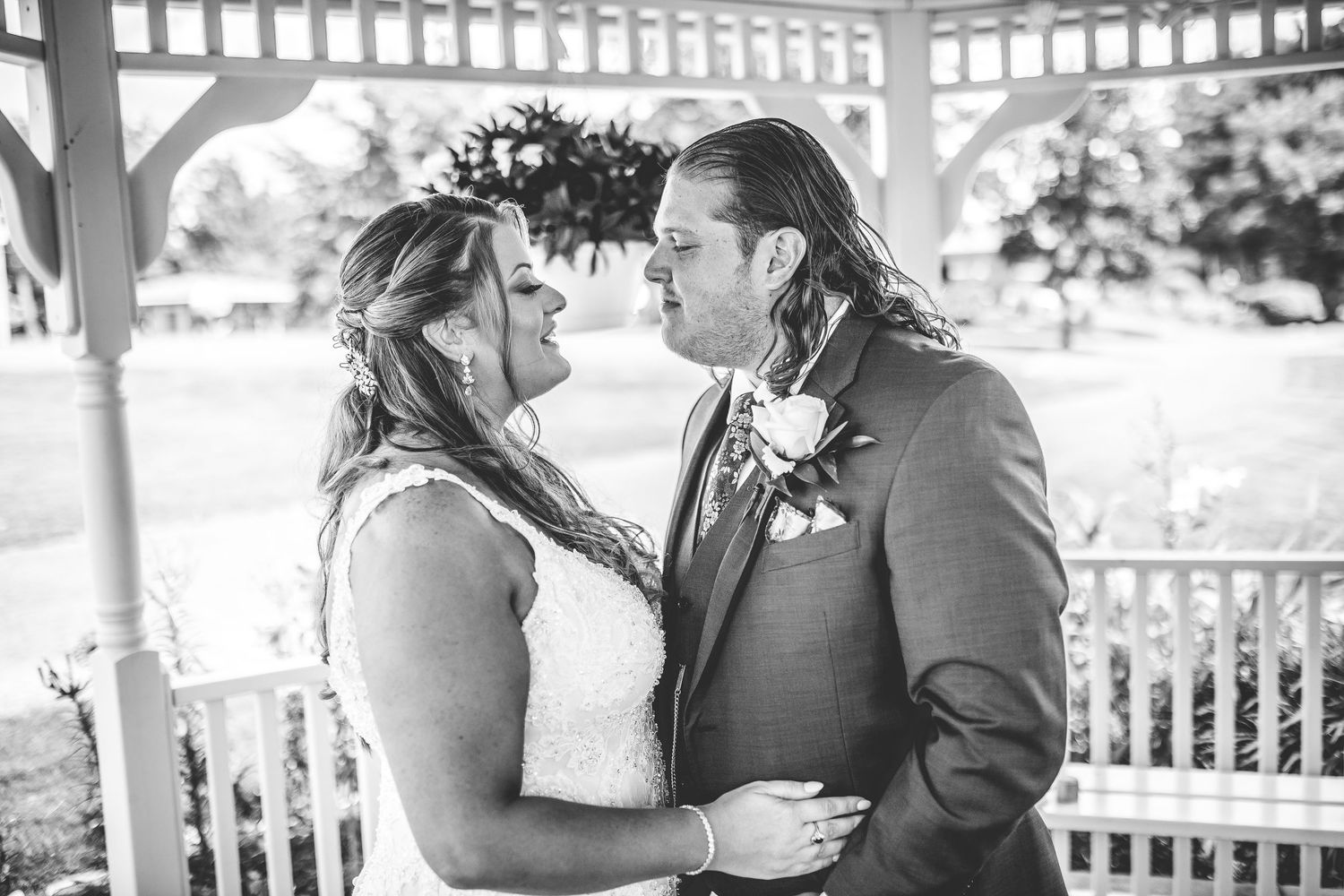 A tender moment between newlyweds sharing their first intimate moments after exchanging vows.