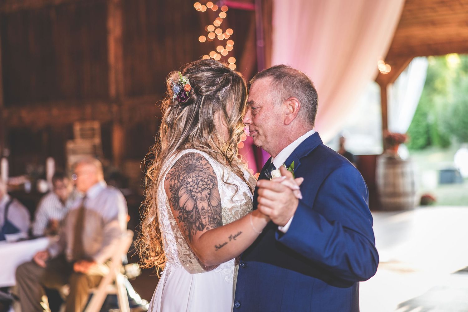 Sequence of dance photos showing emotional moments at a barn wedding reception.