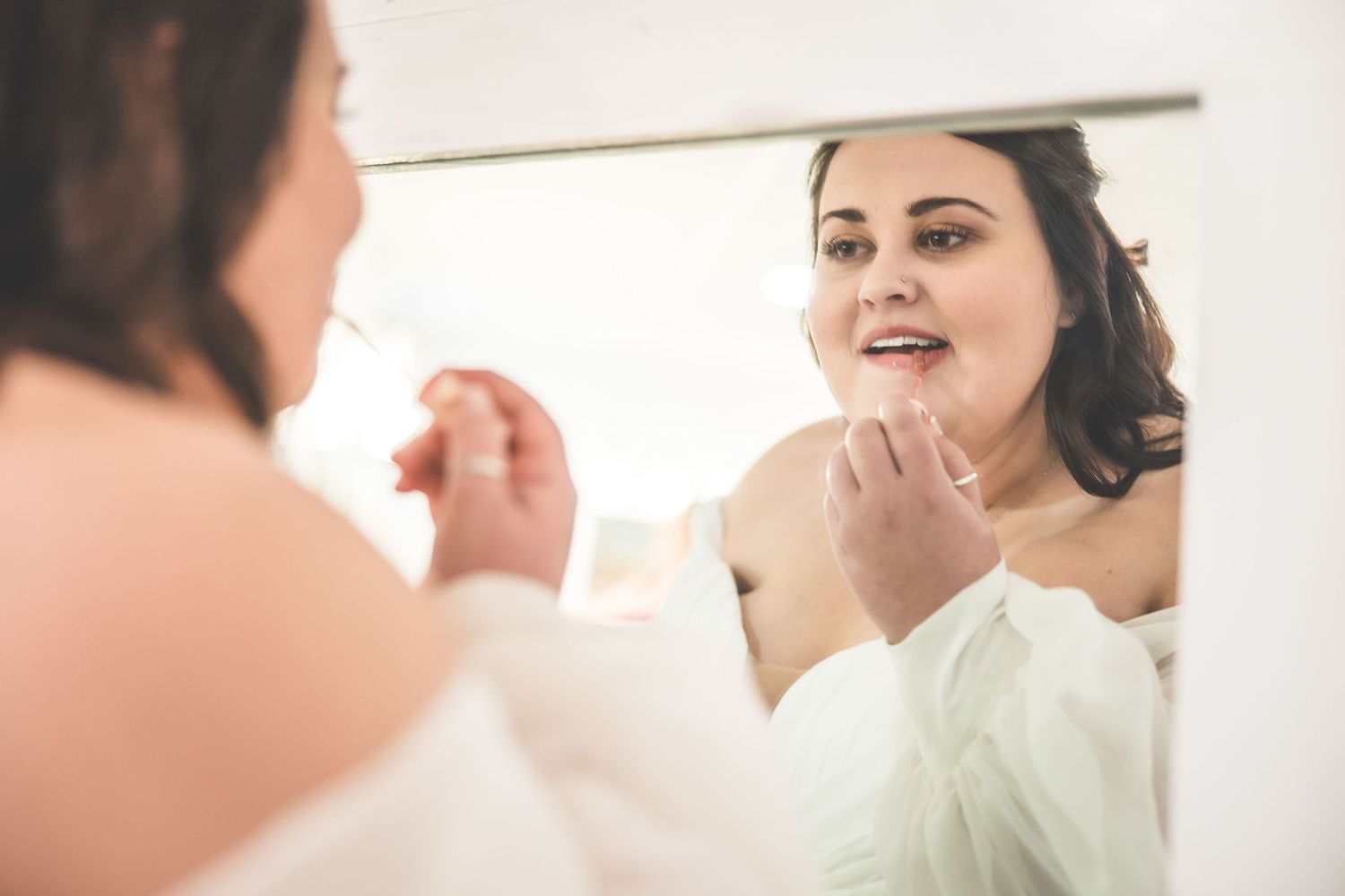Close-up shots of a bride getting ready for her wedding with makeup application.